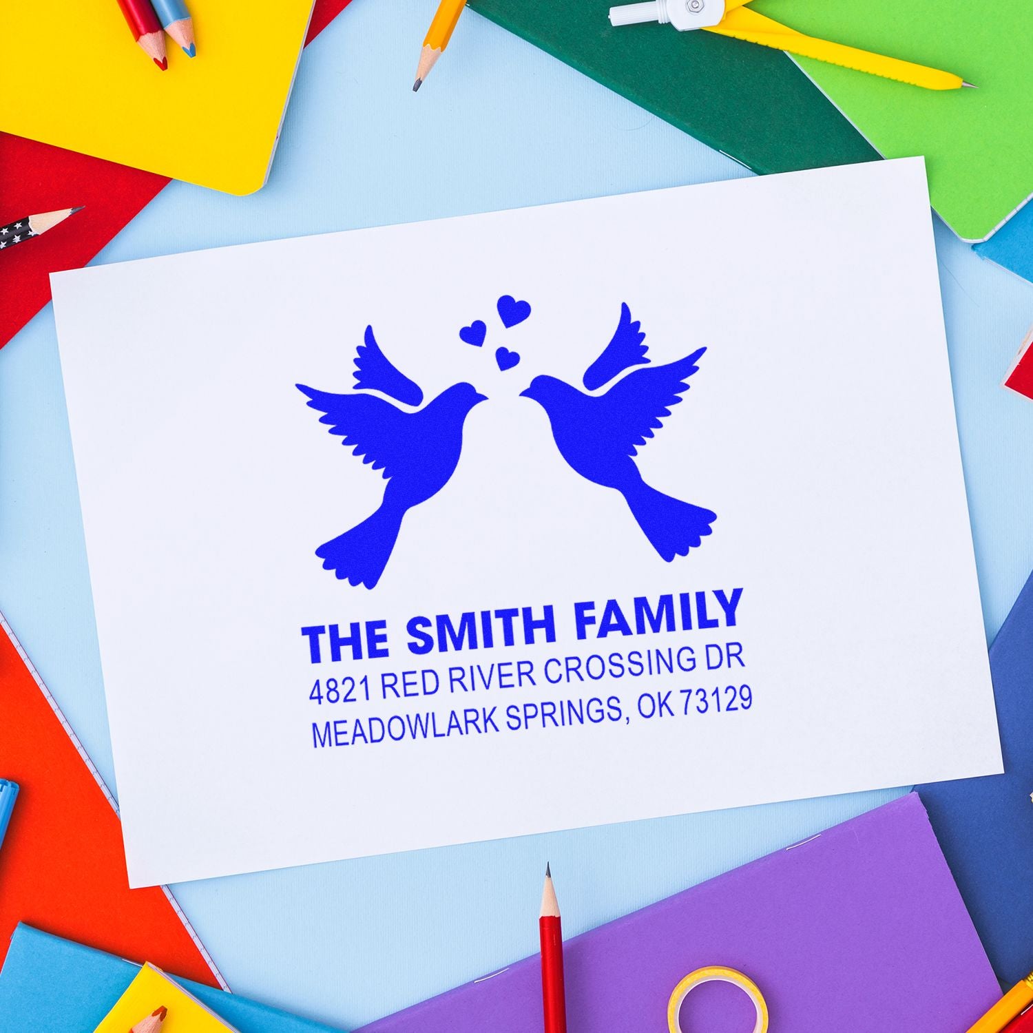 Custom family address rubber stamp with two birds and hearts, featuring The Smith Family name and mailing address for envelopes and stationery.