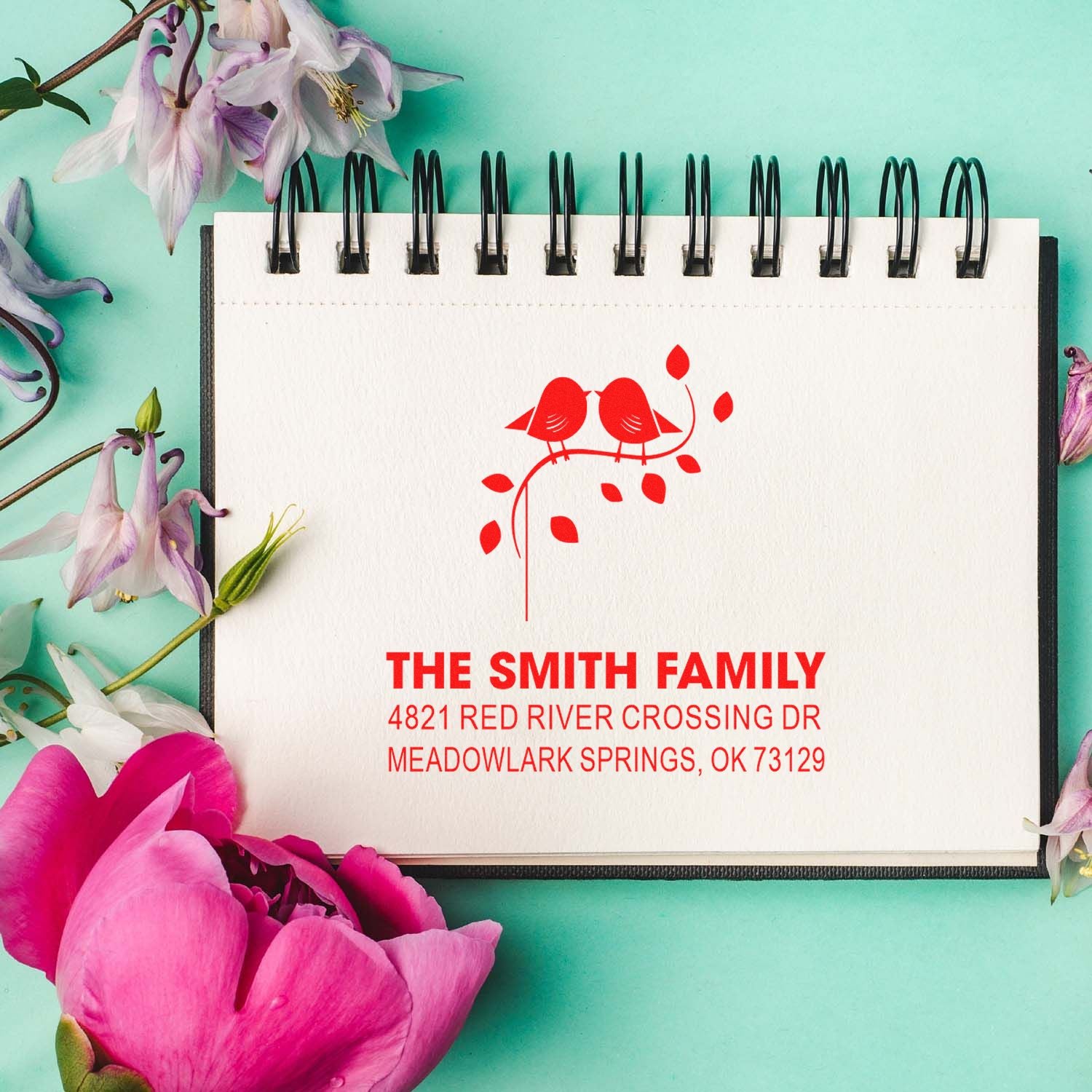 Custom rubber return address stamp with two birds on a branch, red family name and address design for stationery, invitations, and gift giving