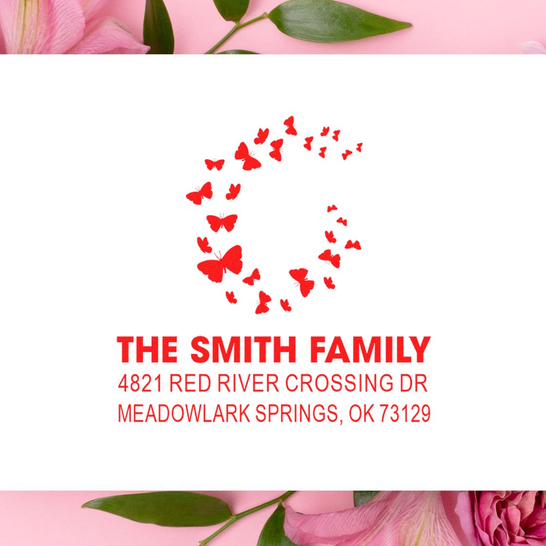 Custom butterfly return address rubber stamp with red butterfly wreath design and personalized family name and mailing address for envelopes