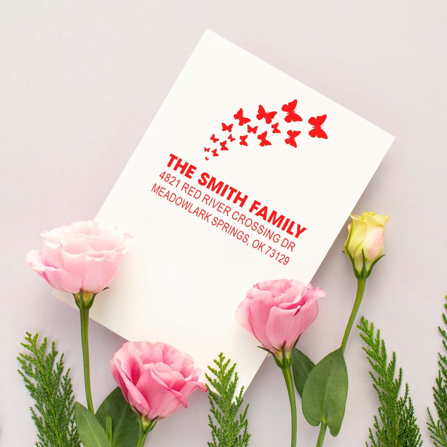 Custom family return address rubber stamp with red butterfly design, ideal for wedding invitations, stationery, and personalized mailing.