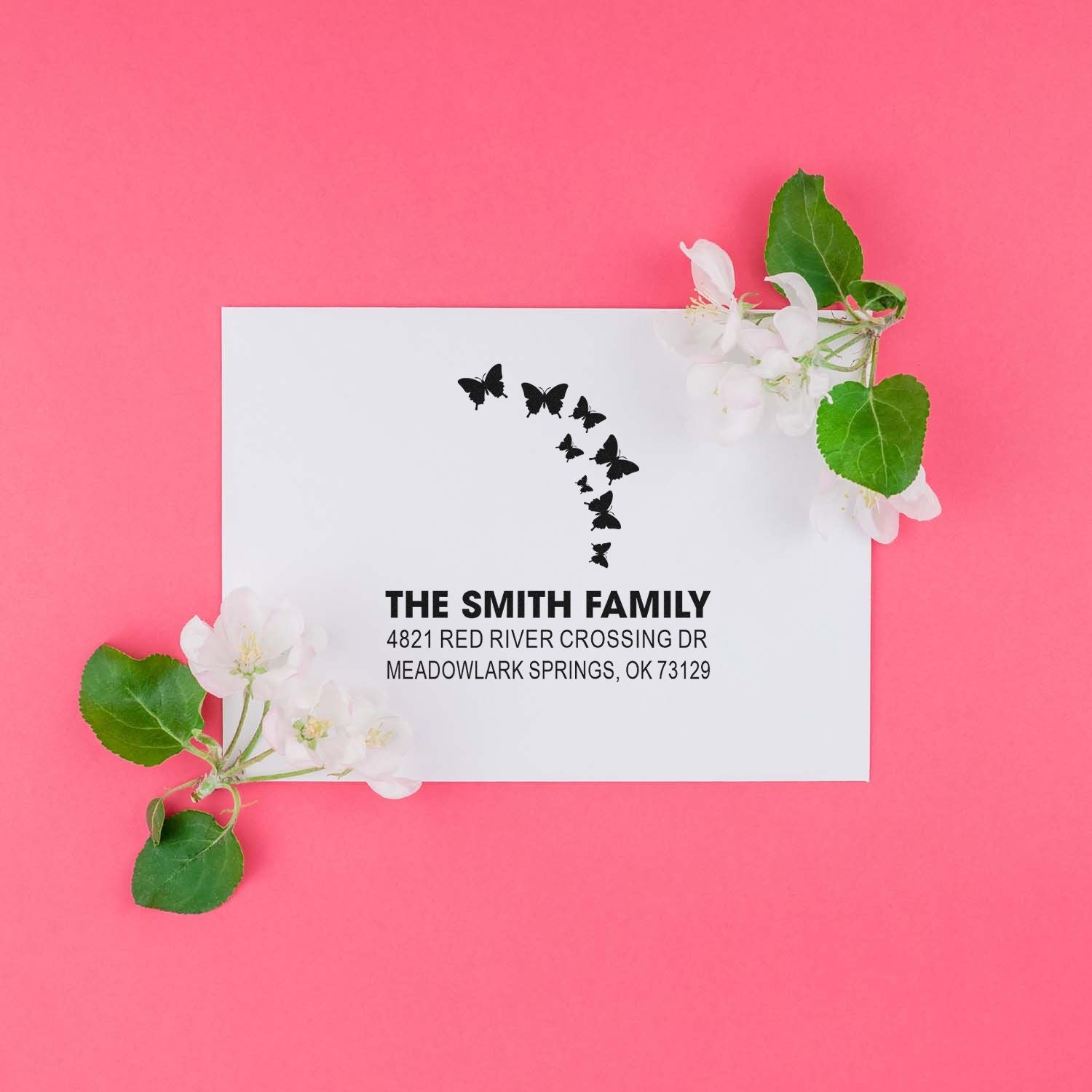 Custom butterfly return address stamp for The Smith Family with elegant address block and floral accent, ideal for weddings and family mailings.