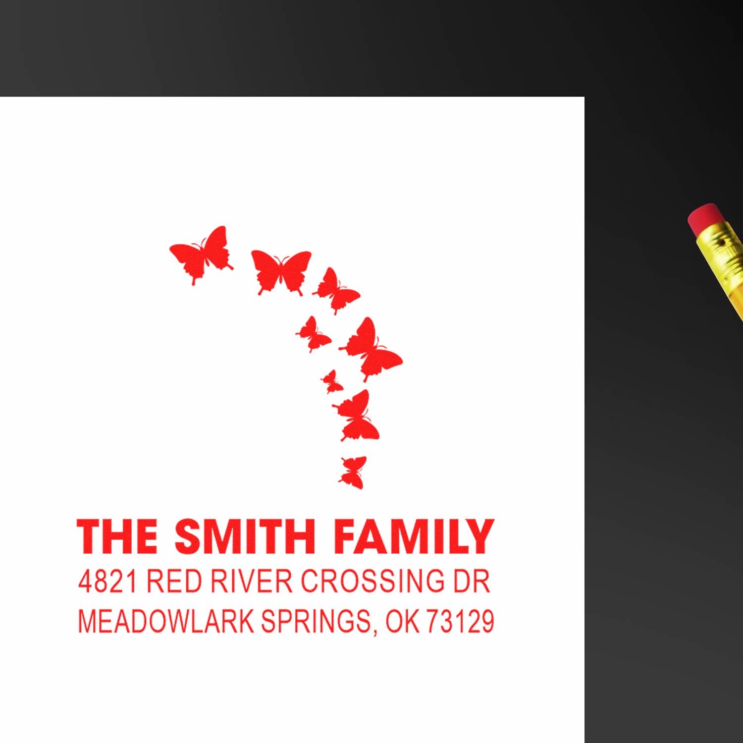 Personalized self-inking rubber address stamp with Florida butterfly design, red ink, Smith family name, and Meadowlark Springs return address.