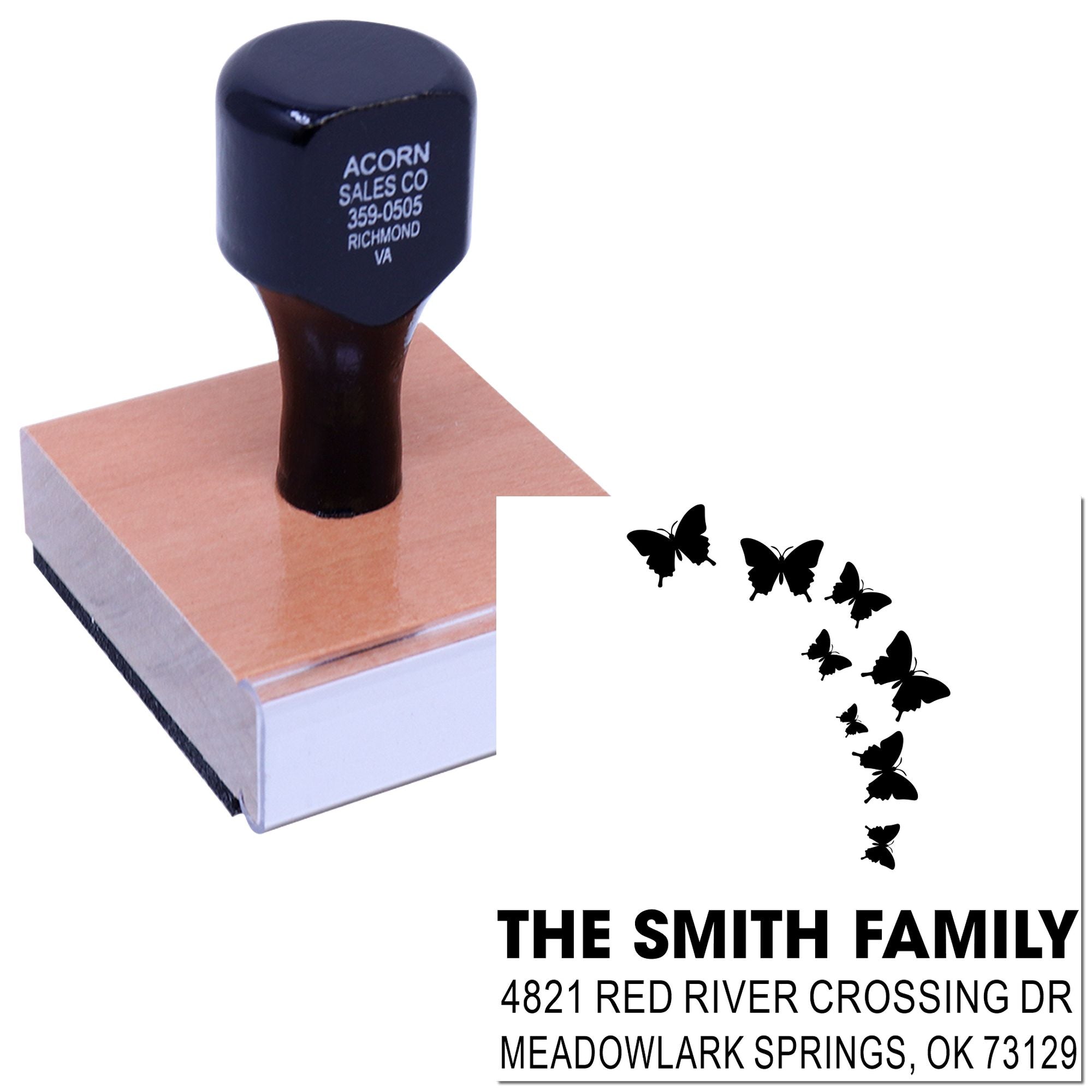Custom butterfly return address rubber stamp with family name and mailing address, mounted on a self-inking stamp for personalized envelope use.