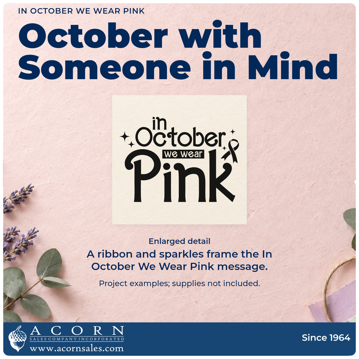 Enlarged detail of the In October We Wear Pink Pre-Inked Stamp – PSI imprint. Mixed lettering reads "In October we wear pink," accented by an awareness ribbon and sparkles.