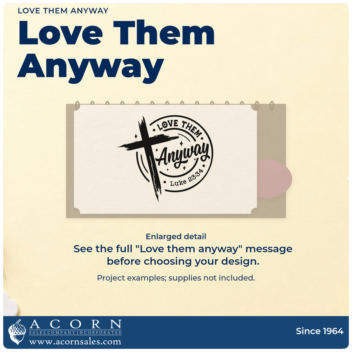 Enlarged detail of the Love Them Anyway Rubber Stamp – Duo Hand imprint. A brushstroke cross overlaps a circular "Love them anyway" design with Luke 23:34.