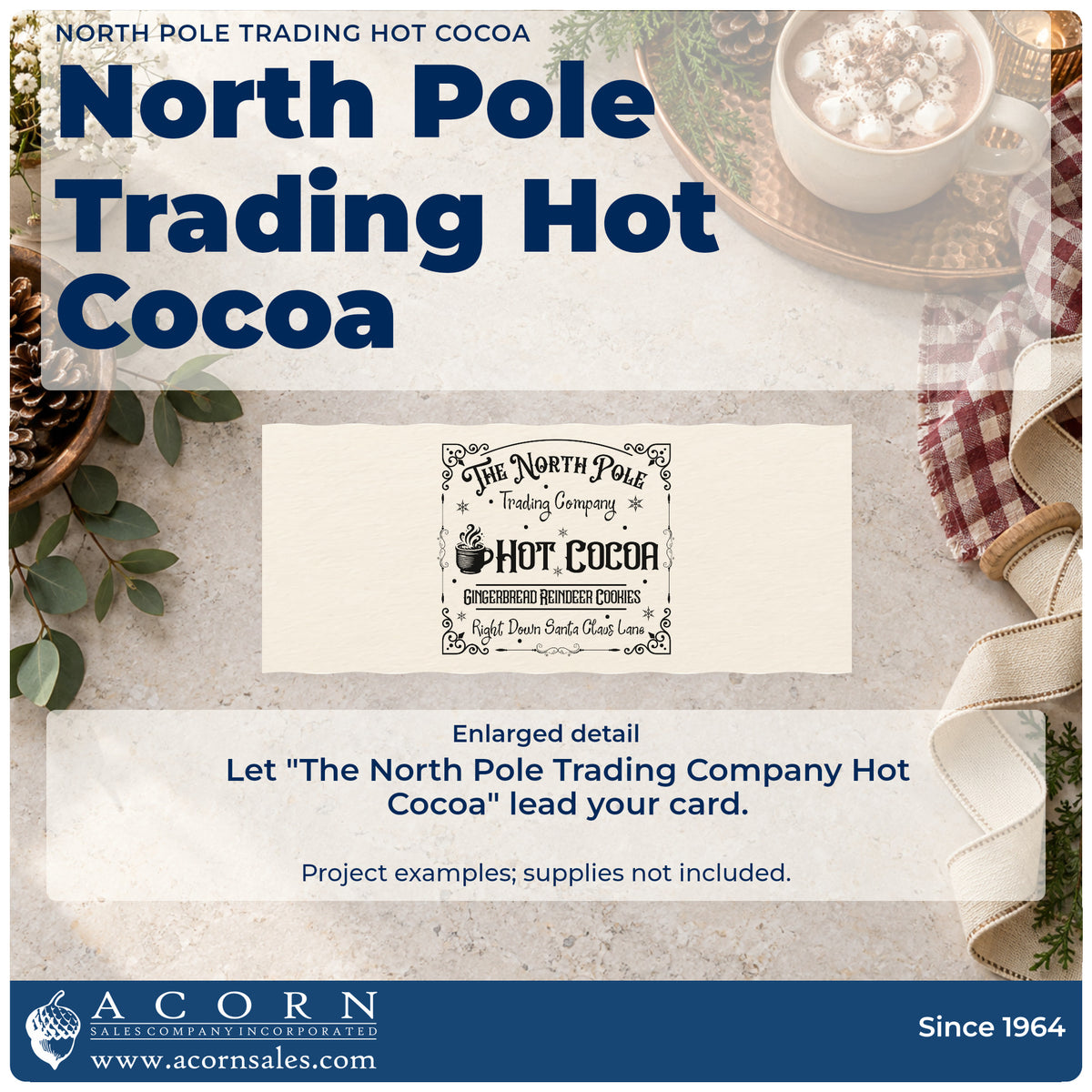 Enlarged detail of the The North Pole Trading Company Hot Cocoa Rubber Stamp – Duo Hand imprint. An ornate rectangular sign reads "The North Pole Trading Company Hot Cocoa" with a steaming mug and gingerbread-reindeer-cookie text.