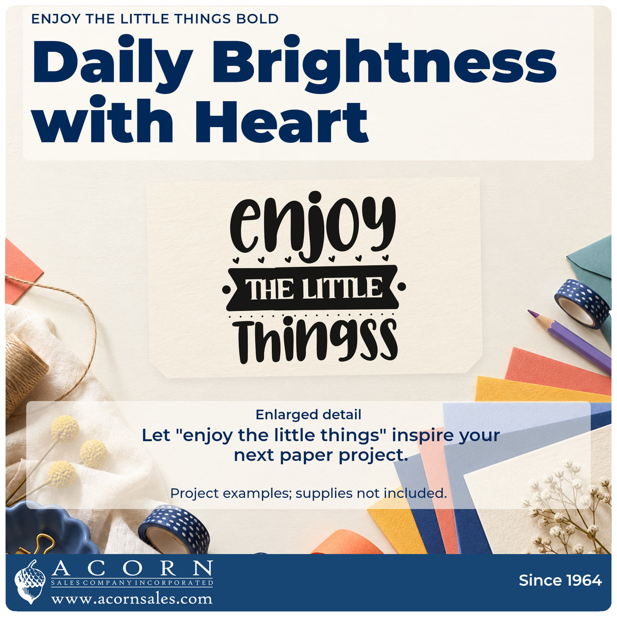 Enlarged detail of the Enjoy The Little Things Bold Stamp – Duo Hand imprint. The phrase "enjoy the little things" appears in heavy lettering with tiny hearts, dots, and a dark banner.