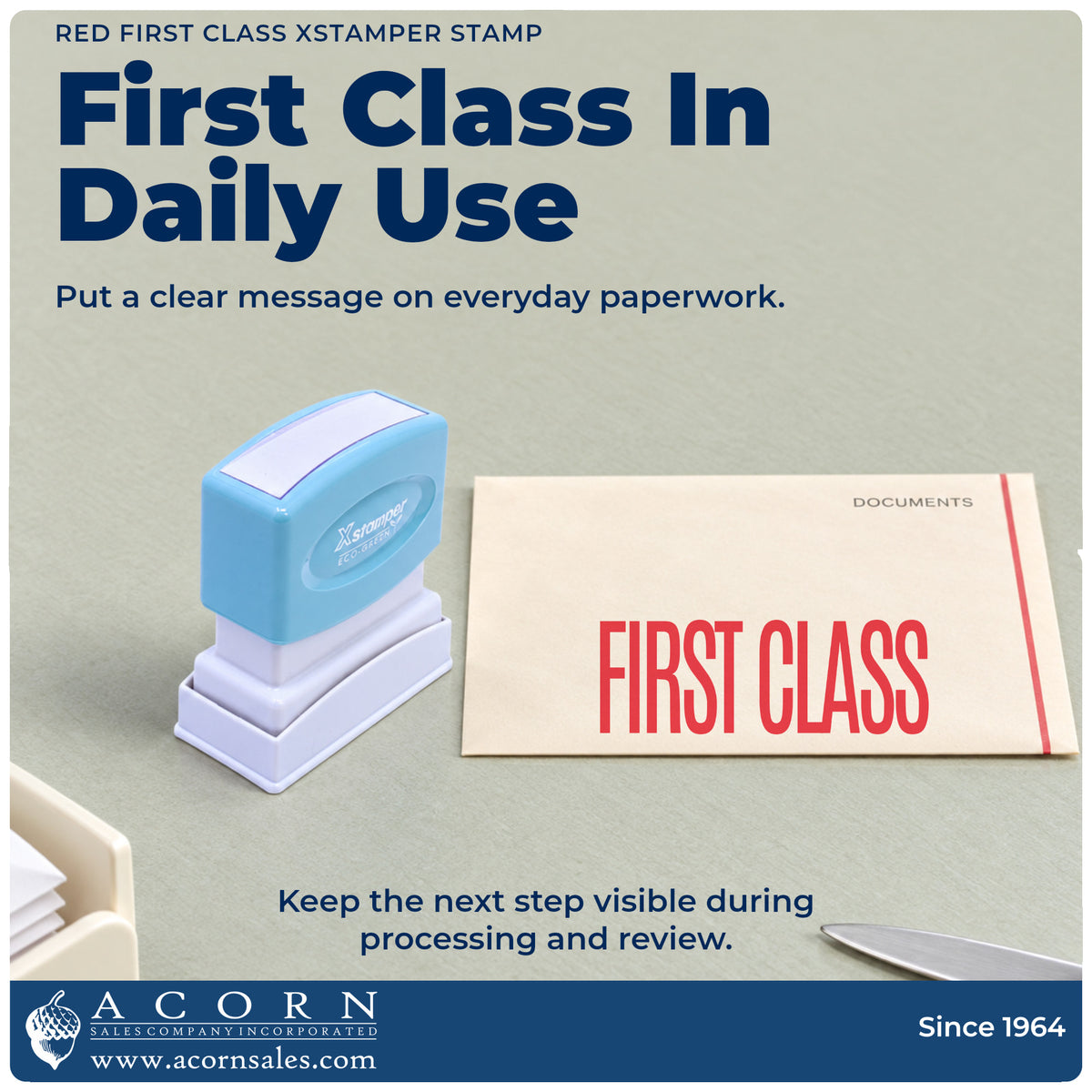 Xstamper First Class Envelope Stamp – Red Pre-Inked being pressed to leave an imprint reading "First class"