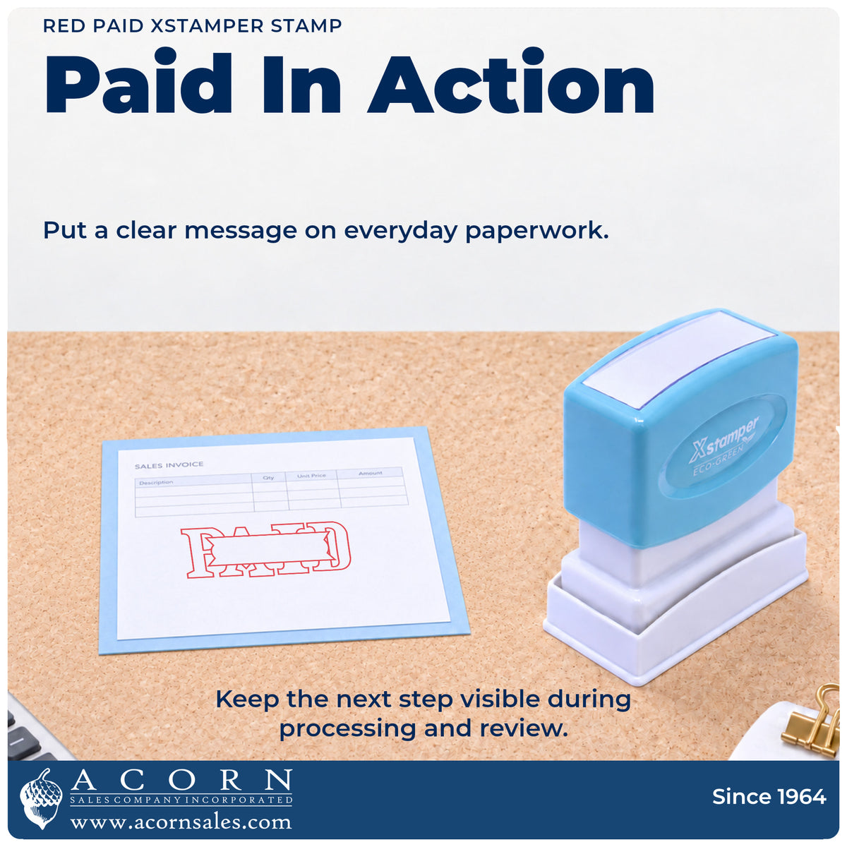 Xstamper Paid Stamp – Red Pre-Inked being pressed to leave an imprint reading "Paid"