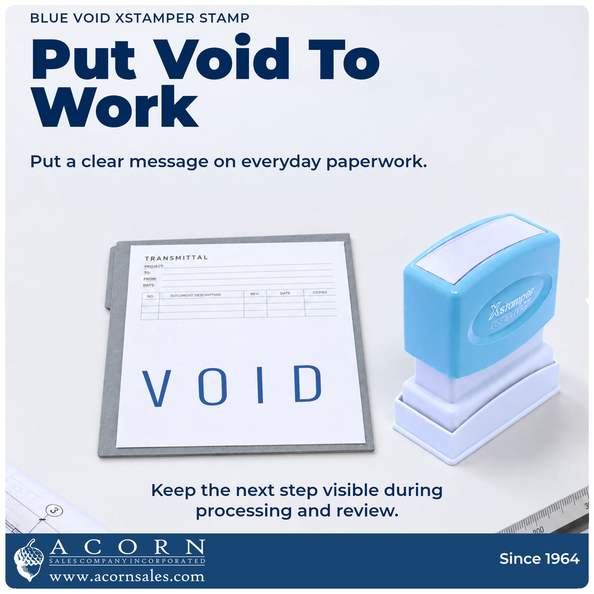 Xstamper Void Stamp – Blue Pre-Inked being pressed to leave an imprint reading "Void"