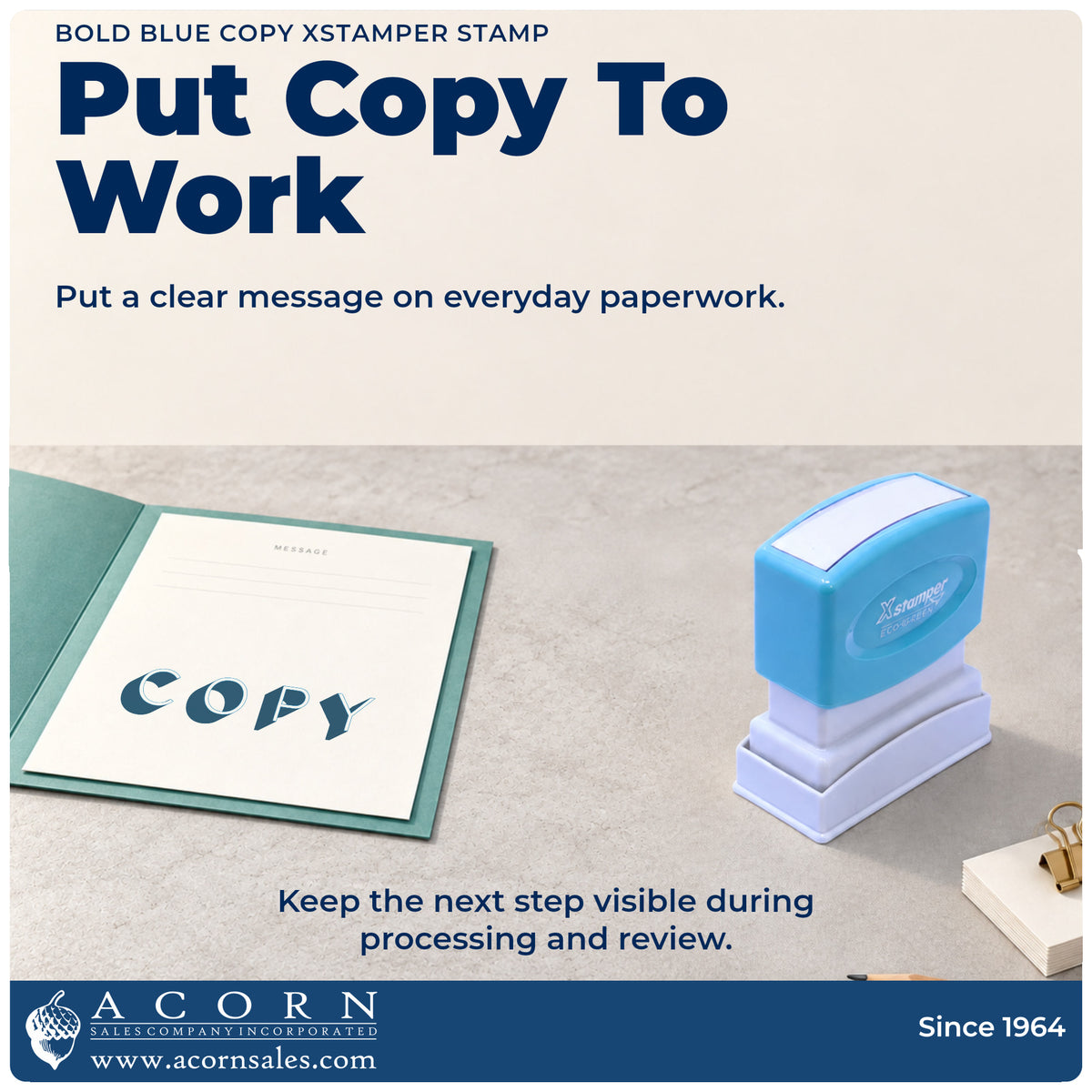 Xstamper Copy Stamp – Bold Blue Pre-Inked being pressed to leave an imprint reading "Copy"