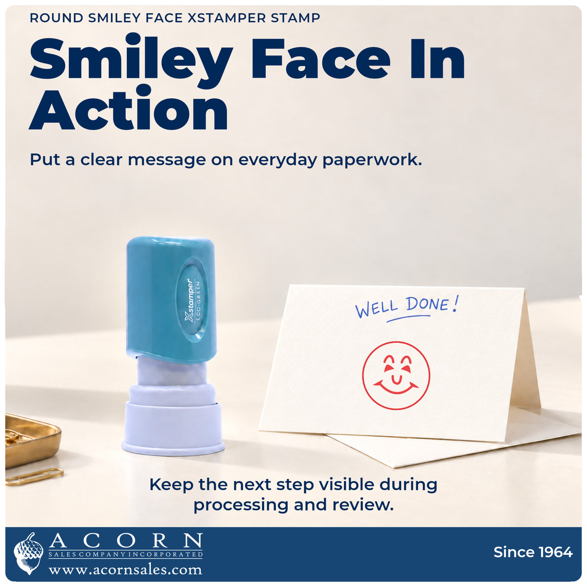 Round Red Smiley Face Teacher Stamp being pressed to leave an imprint reading "Smiley face"