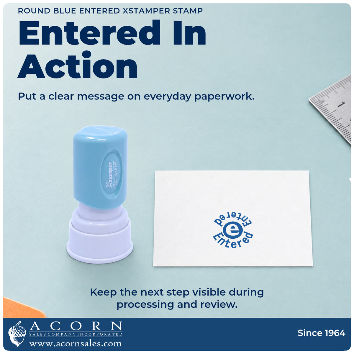 Xstamper Entered Data Entry Stamp – Round Blue Pre-Inked being pressed to leave an imprint reading "Entered"