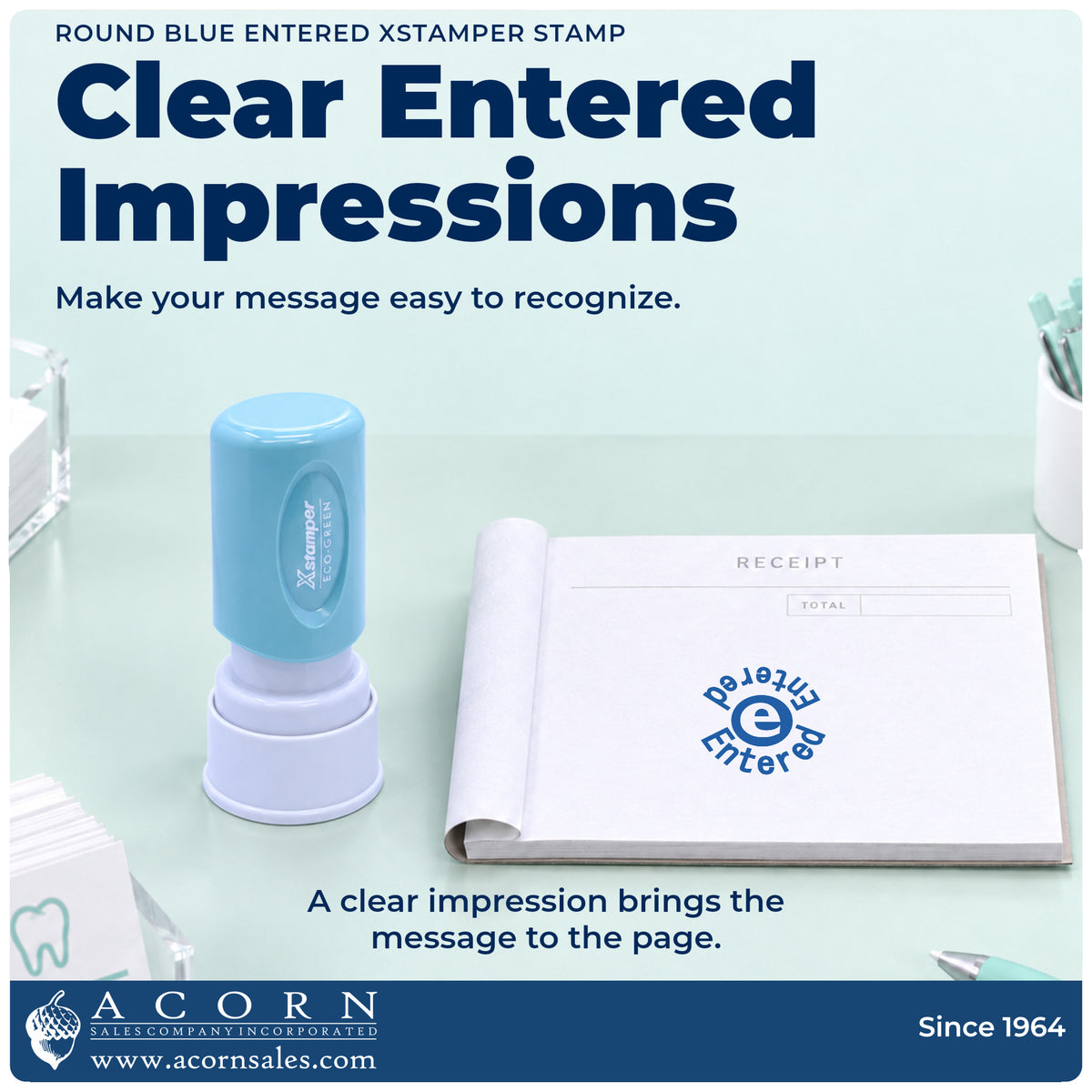 "Entered" imprint on office paperwork beside the Xstamper Entered Data Entry Stamp – Round Blue Pre-Inked
