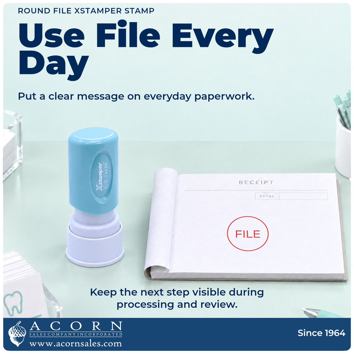 Round File Document Stamp being pressed to leave an imprint reading "File"