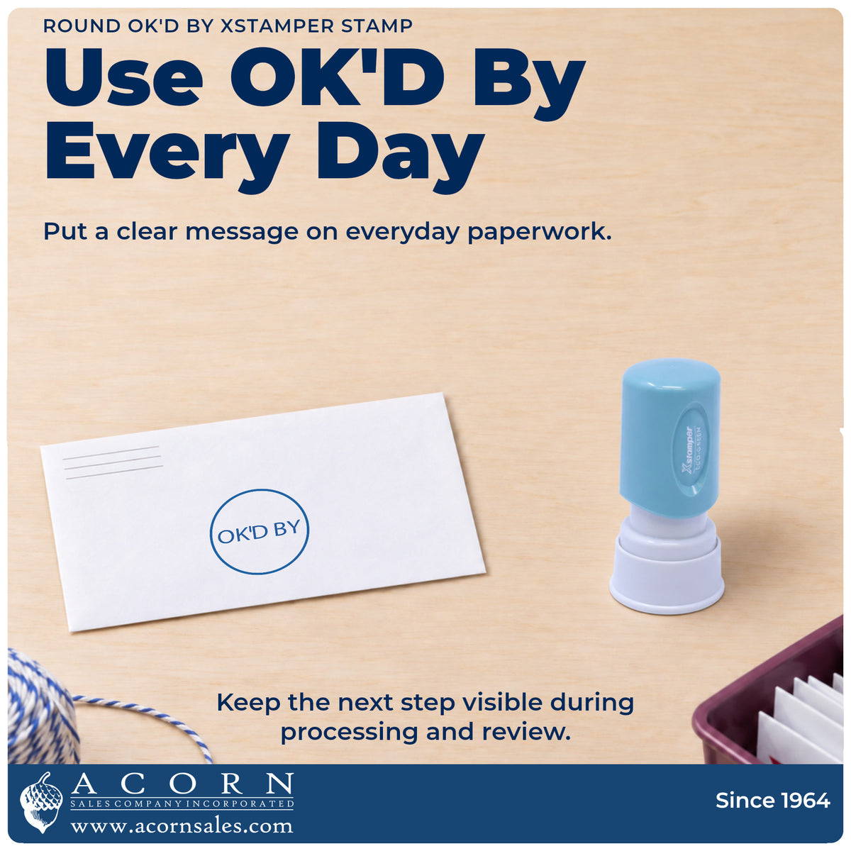 Xstamper OK'd By Approval Stamp – Round Pre-Inked being pressed to leave an imprint reading "OK'd by"