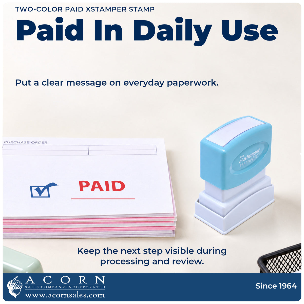 Two-Color Paid Stamp being pressed to leave an imprint reading "Paid"