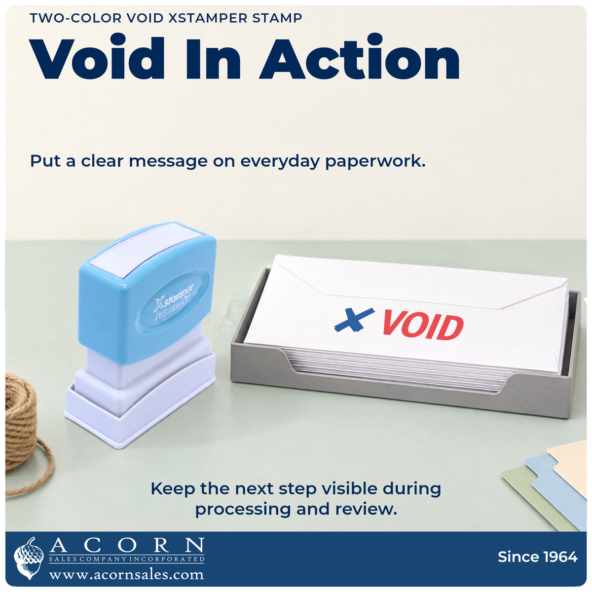 Xstamper Void Check Stamp being pressed to leave an imprint reading "Void"