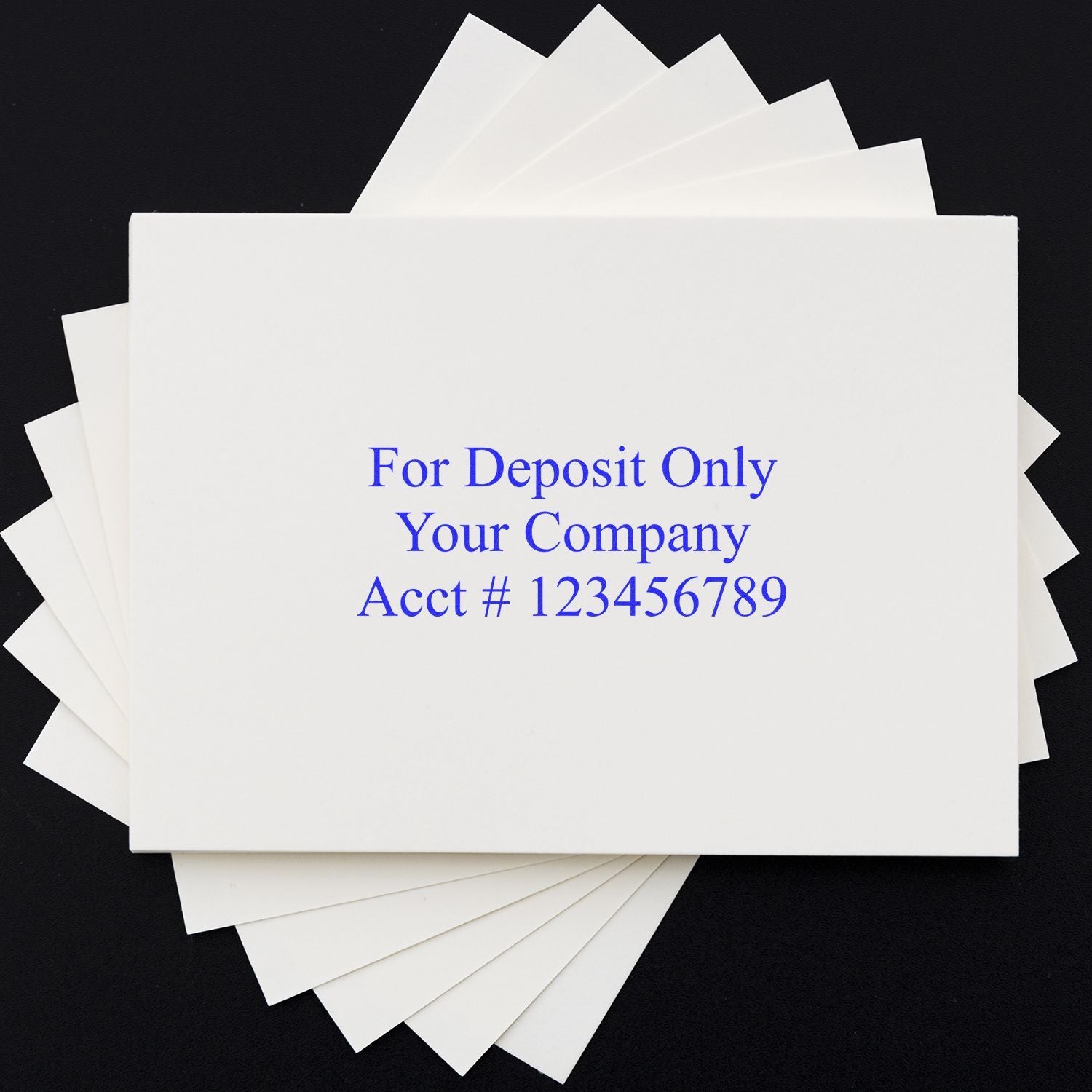 Stack of customized business deposit slips with “For Deposit Only” imprint on a black background
