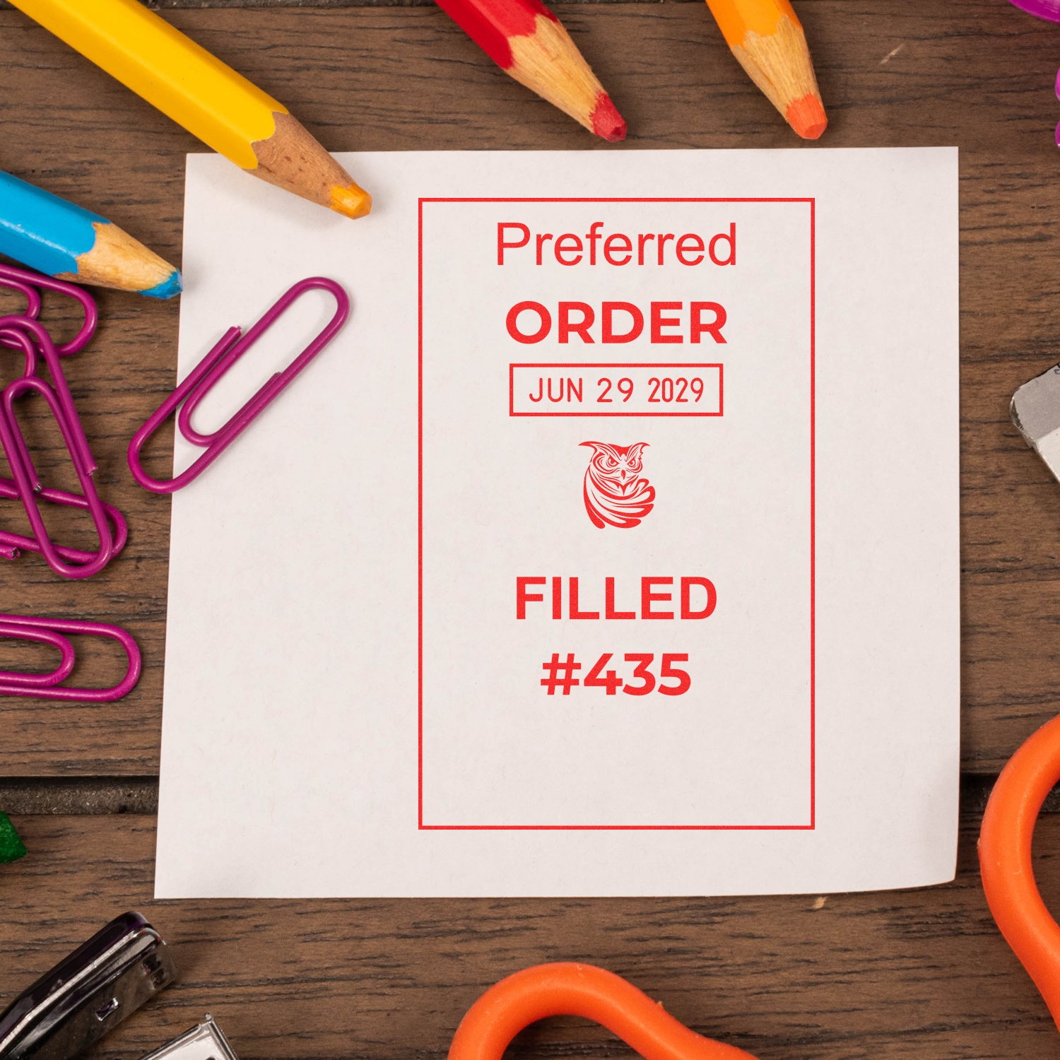 Preferred order form marked filled with date June 29, 2029, surrounded by colorful pencils and paper clips on a wooden desk.
