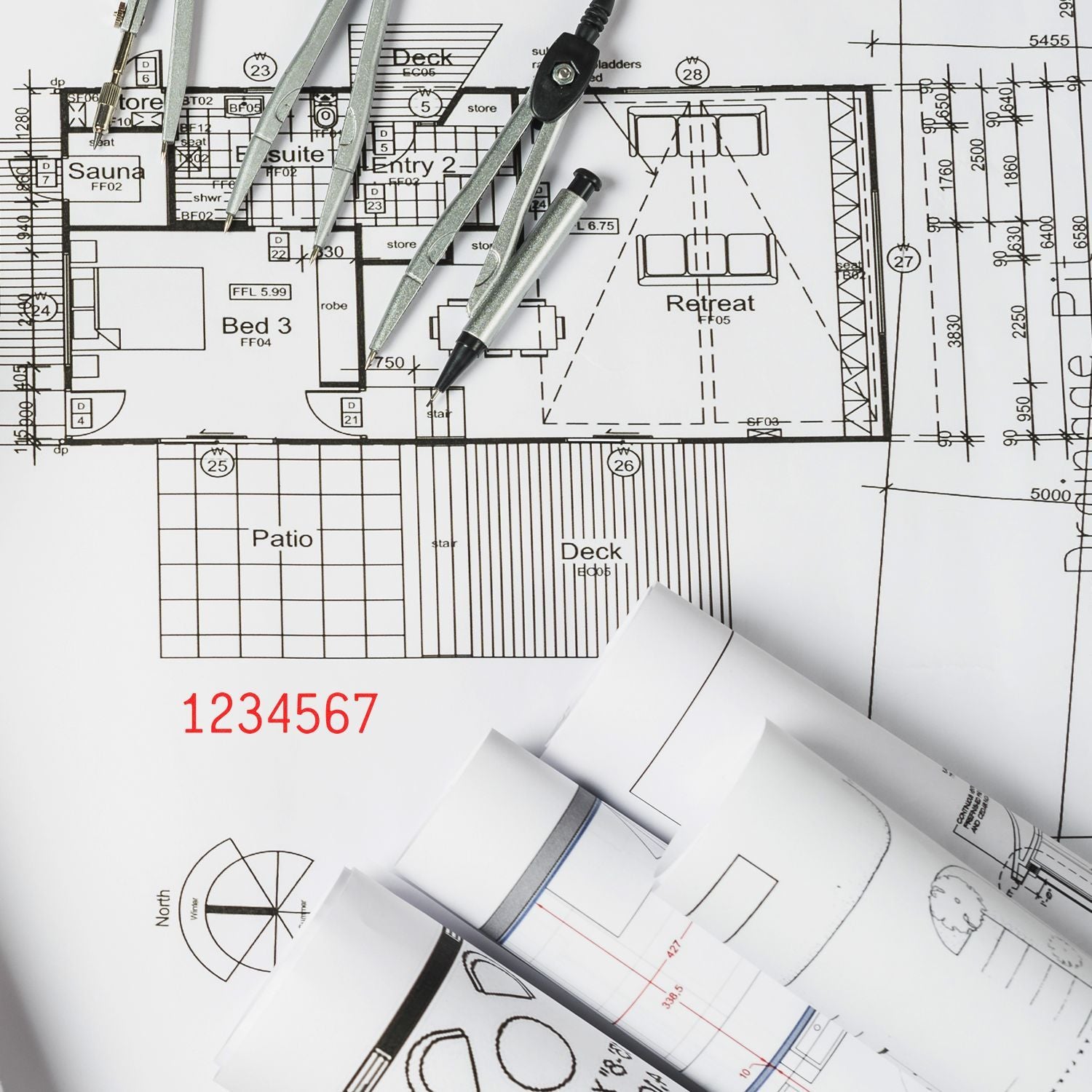 Architectural blueprint with drafting tools, compass, and rolled house floor plans on a design desk.
