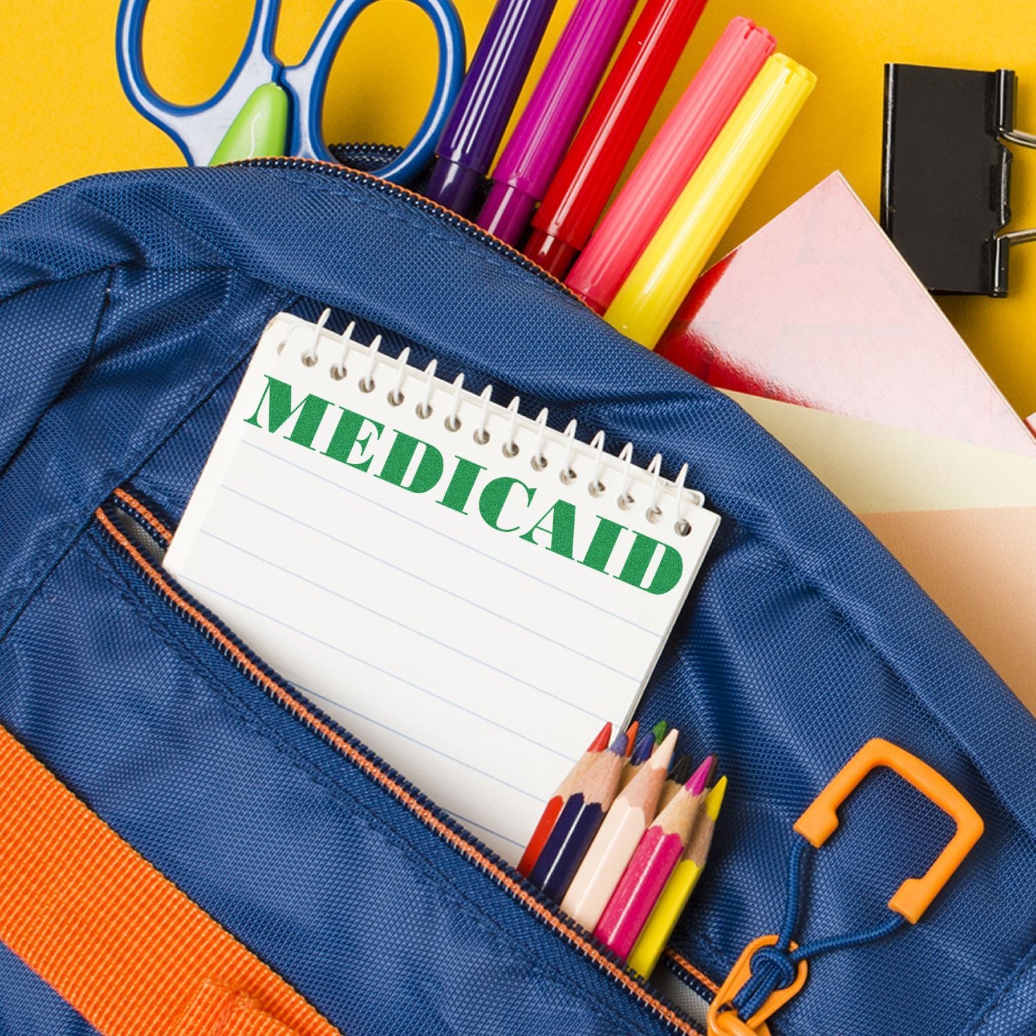 Blue pencil pouch with MEDICAL notebook, colored pencils and markersback to school supplies for learning and education.