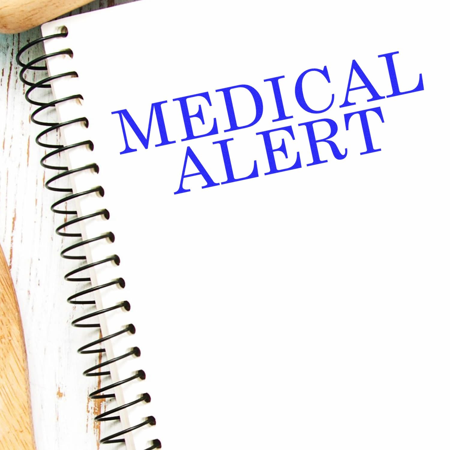 Medical Alert notebook with spiral binding and bold blue MEDICAL ALERT text for safety and first-aid information, quick reference guide.