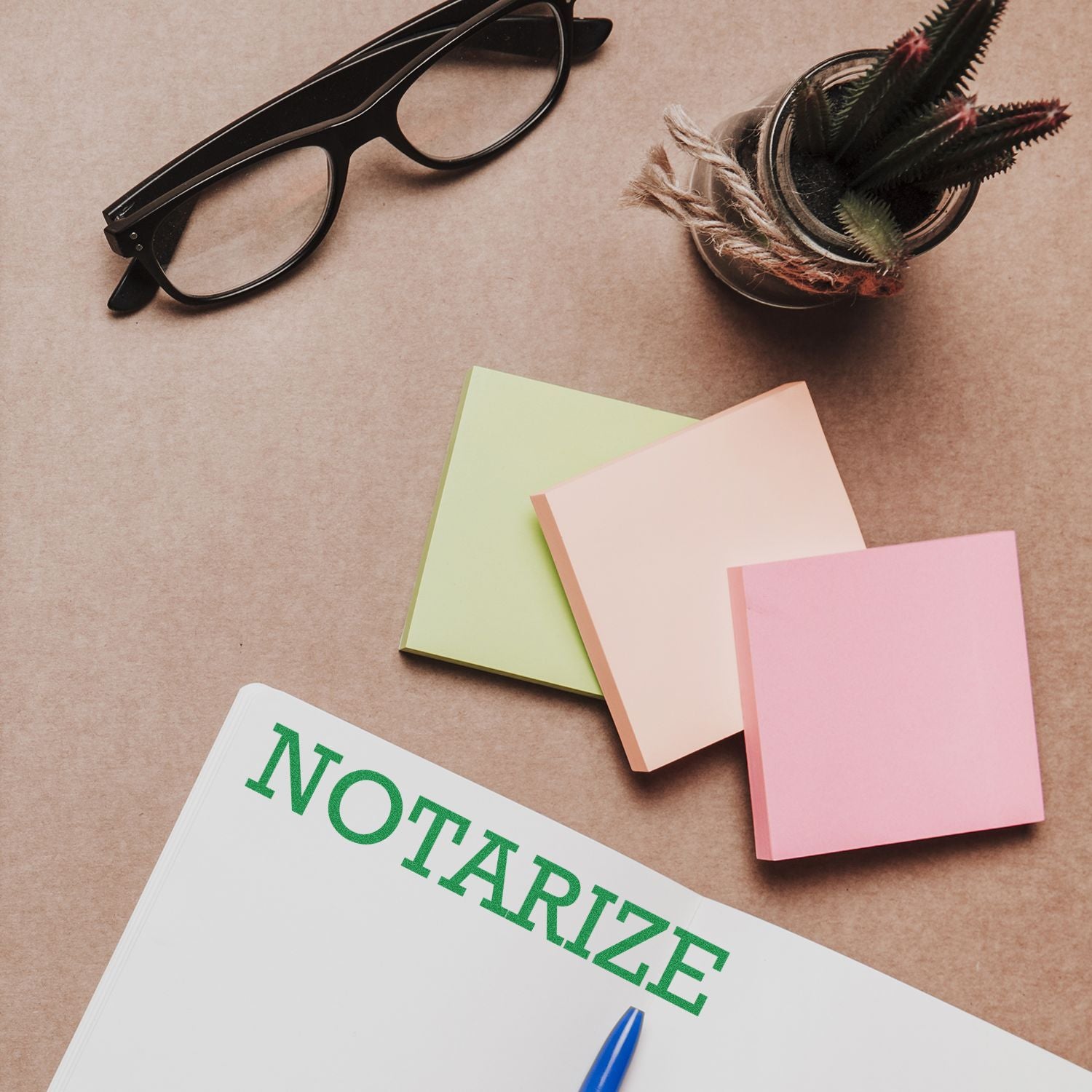 Notarize document concept with glasses, feather pen, and pastel sticky notes on kraft paper background for official paperwork SEO