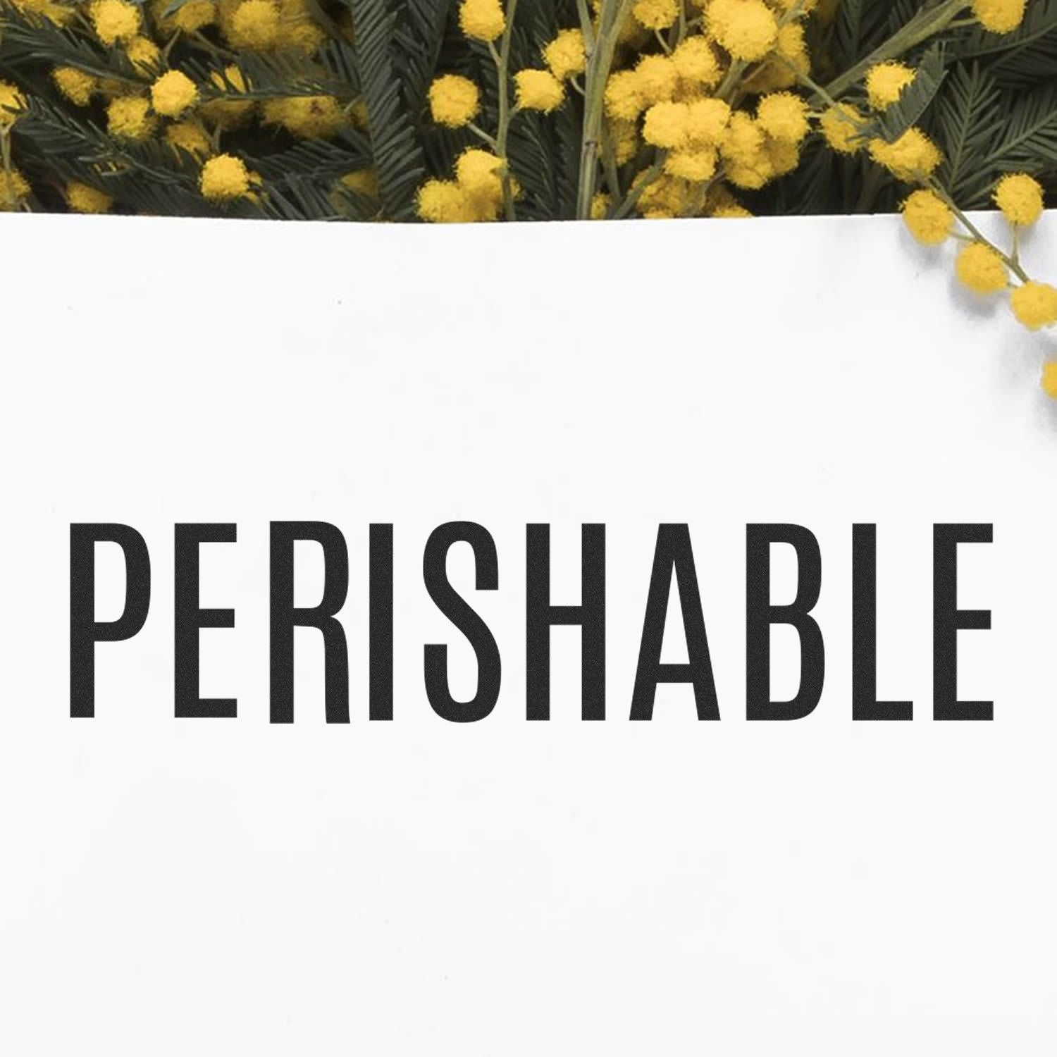 Perishable warning with bold black text over yellow mimosa flowers, indicating food storage requirements for fresh goods.
