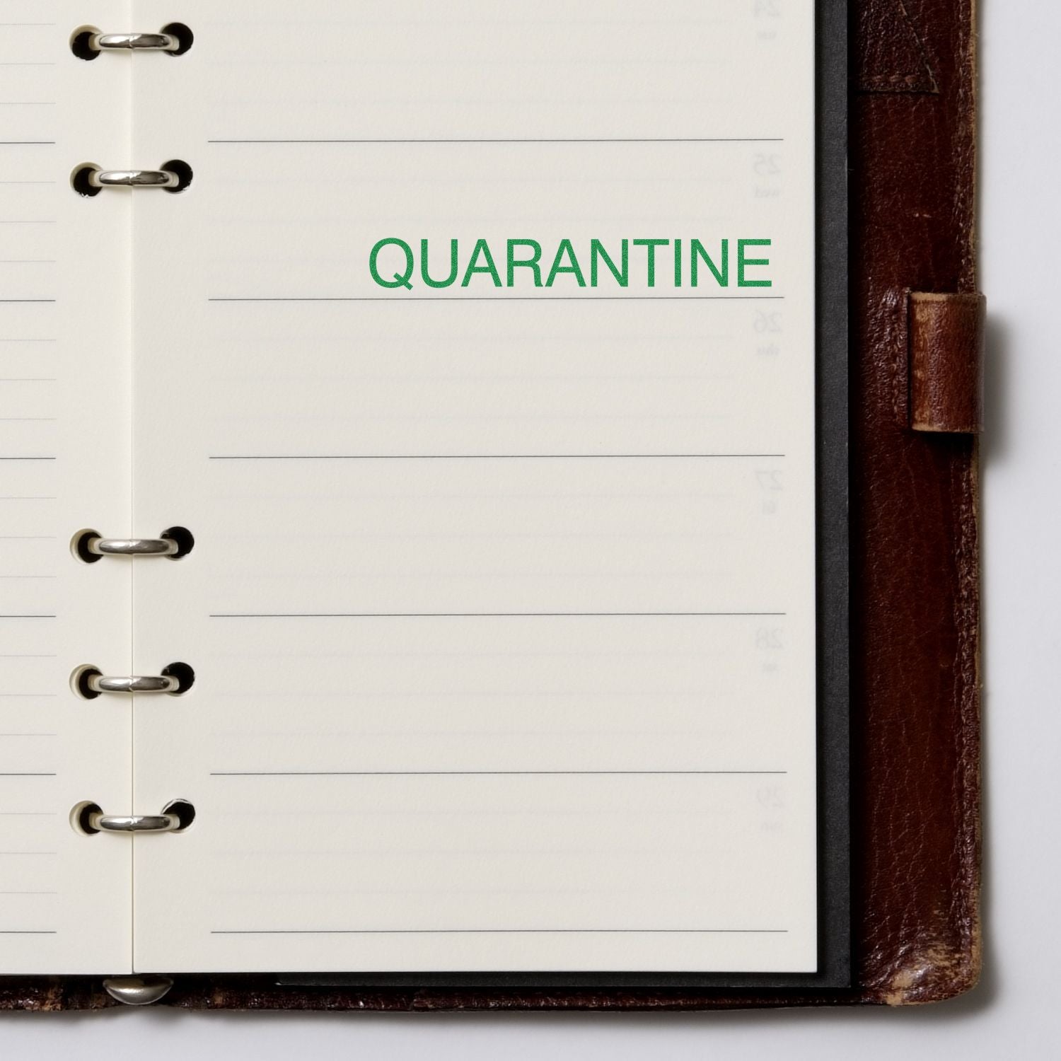 Quarantine journal notebook with lined pages and QUARANTINE title, used for health updates and stay-at-home notes.