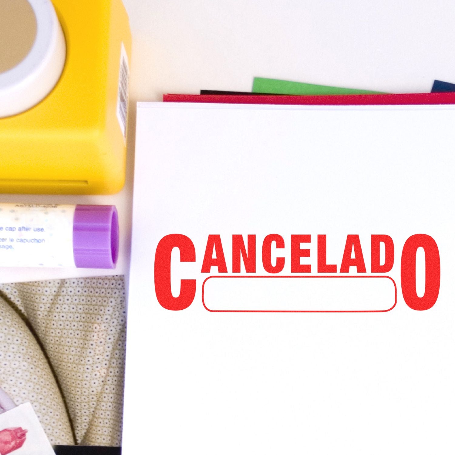 Stamp CANCELADO over personal care supplies and notebooks, highlighting a cancelled order or status.