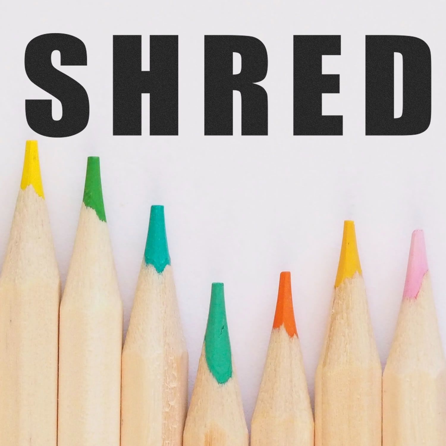 SHRED text branding with colored pencil tips below, highlighting stationery artwork and educational creativity for school posters.