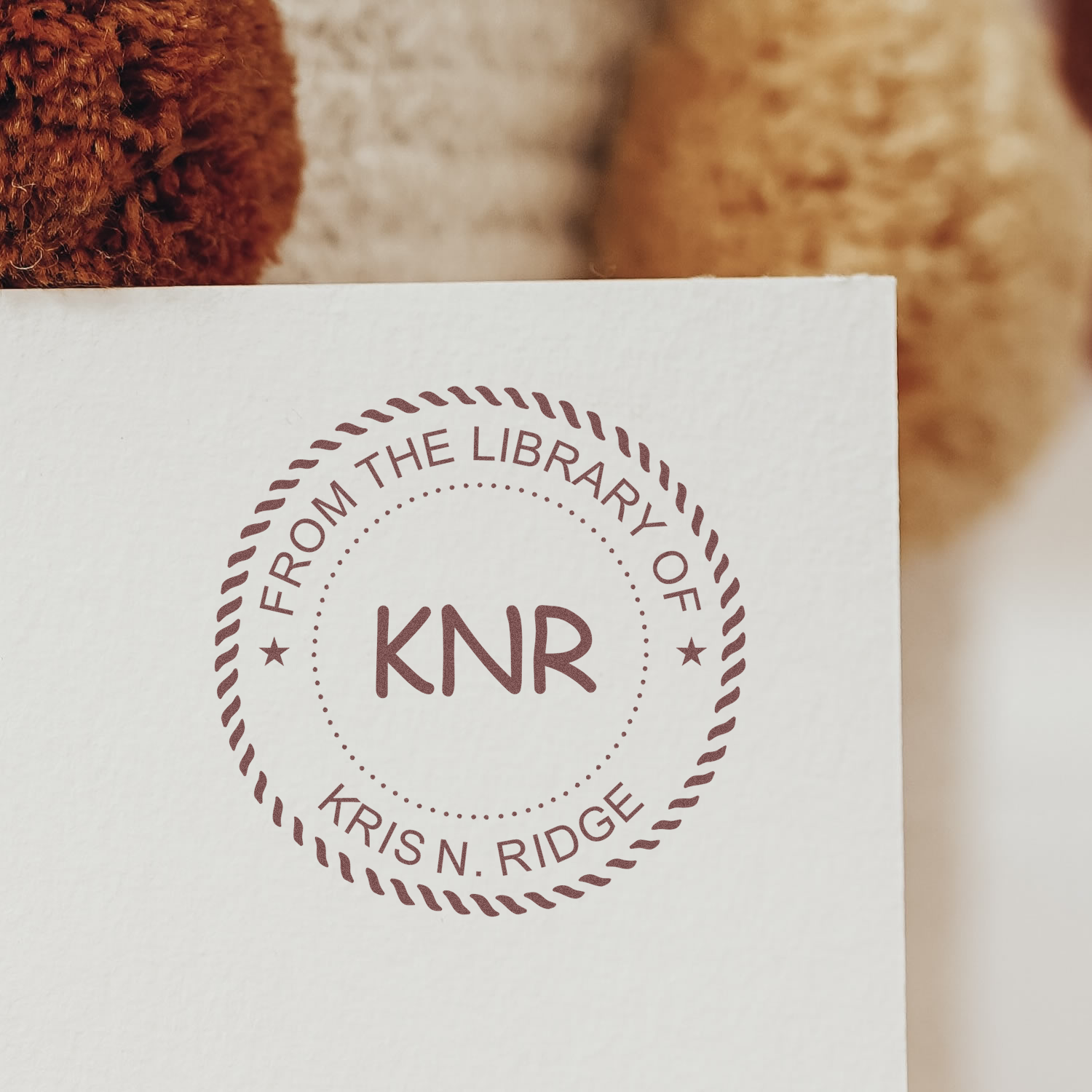 Custom From the Library of Kris N. Ridge rubber stamp with KNR monogram for personalized books.