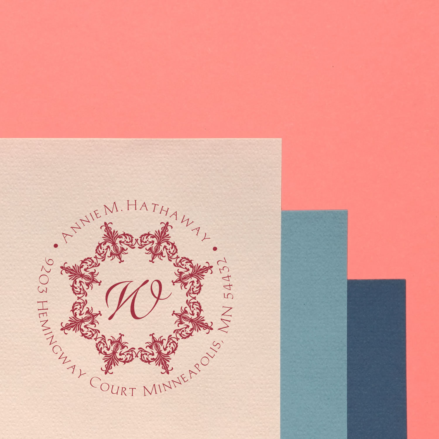 Custom floral monogram return address rubber stamp with personalized name and Minneapolis address.