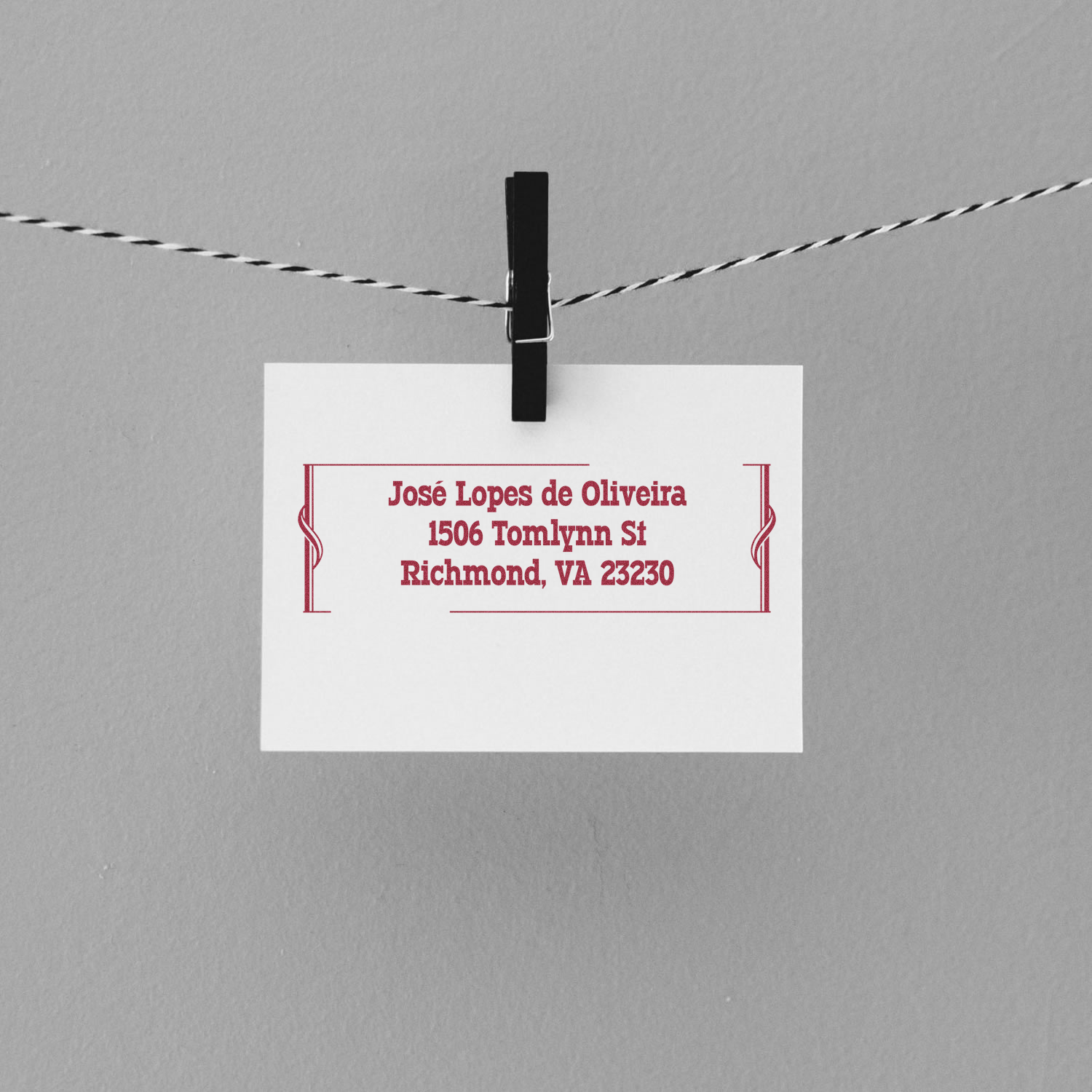 Personalized rubber return address stamp for Jos Lopes de Oliveira, Richmond, VA, shown on a hanging card.
