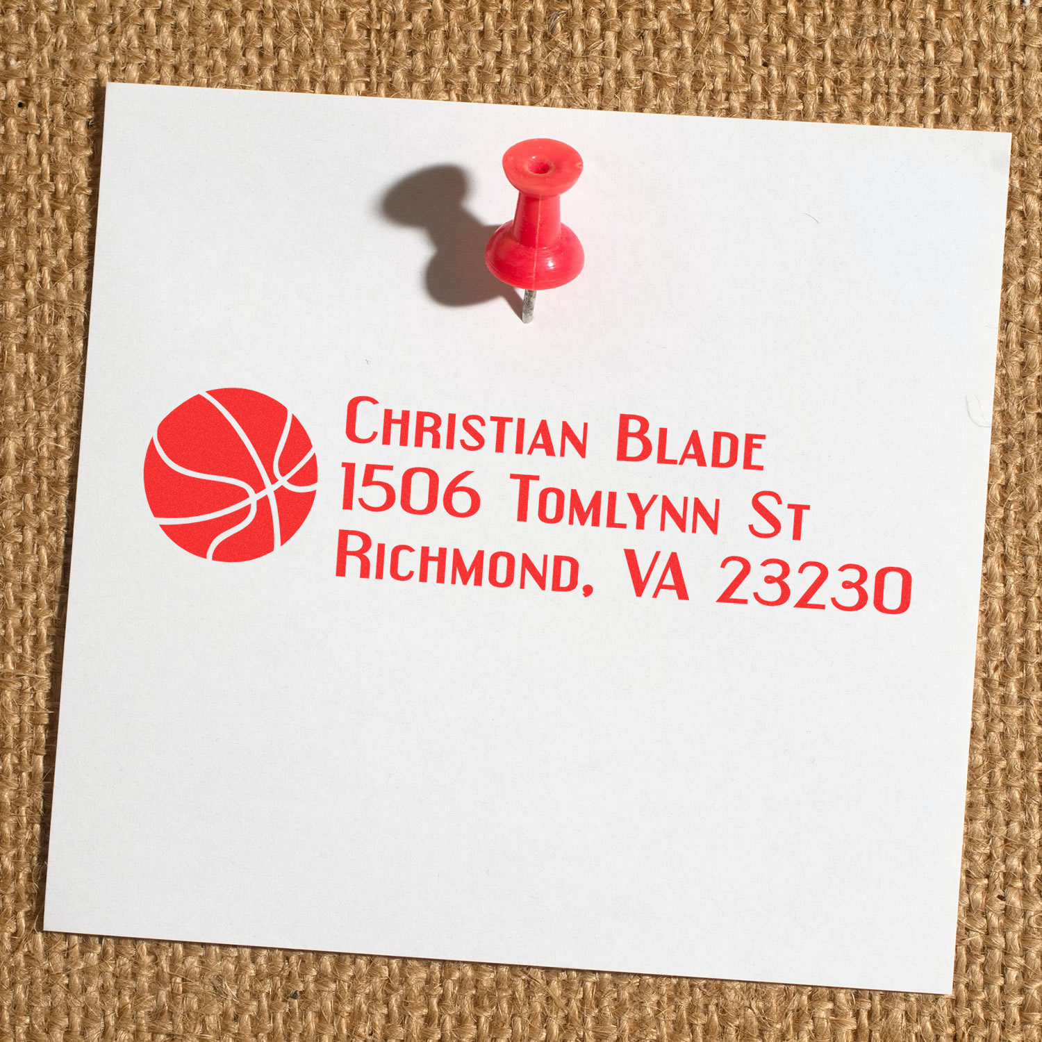 Red custom return address rubber stamp with basketball logo for Christian Blade, 1506 Tomlynn St, Richmond, VA 23230.