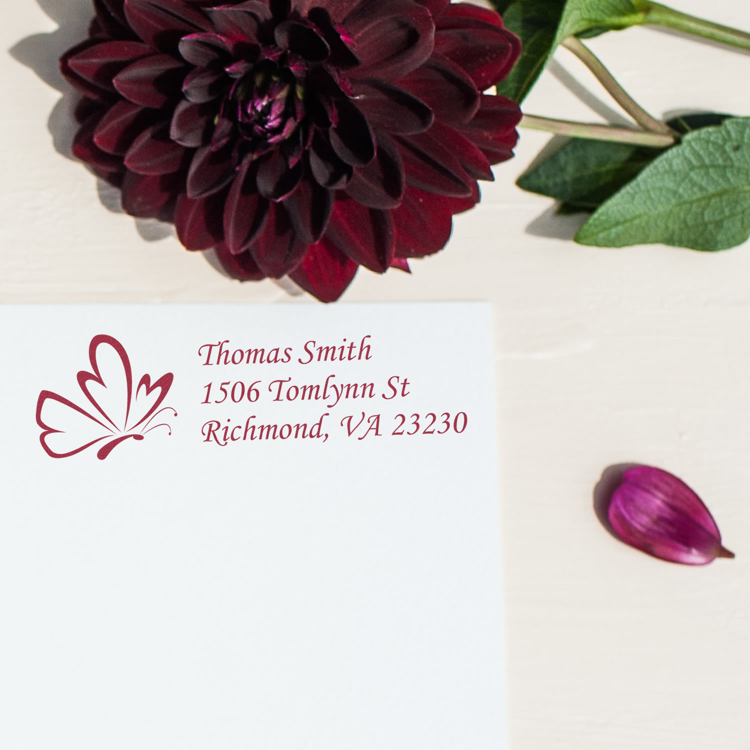 Personalized return address rubber stamp with butterfly floral design for Thomas Smith, Richmond, VA 23230.