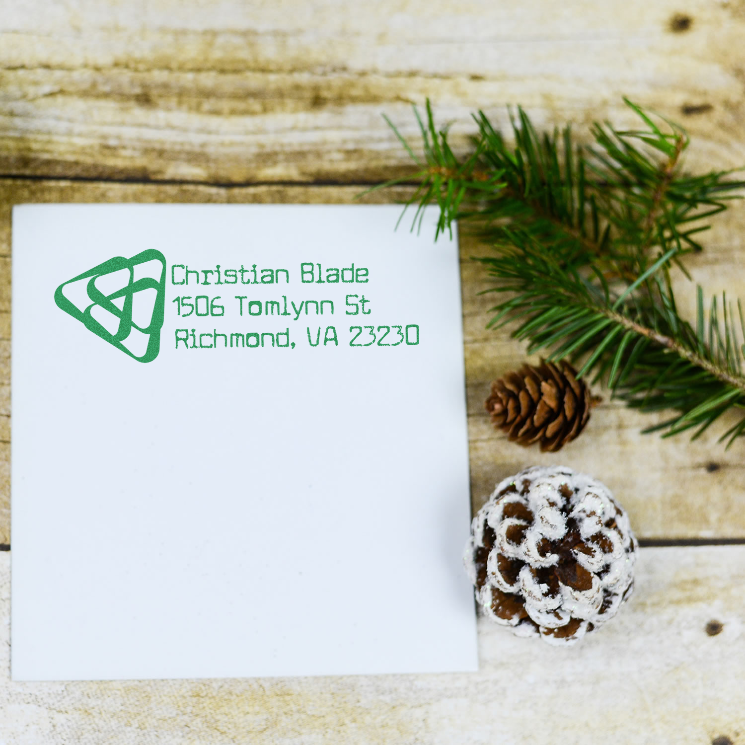 Custom rubber address stamp on envelope for Christian Blade, 1506 Tomlynn St, Richmond, VA 23230.