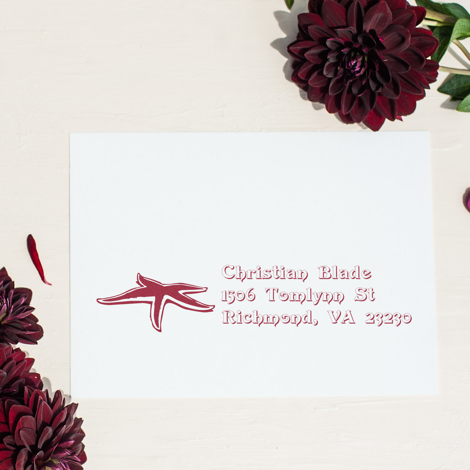 Custom return address rubber stamp with floral design for Christian Blade, Richmond, VA 23230.