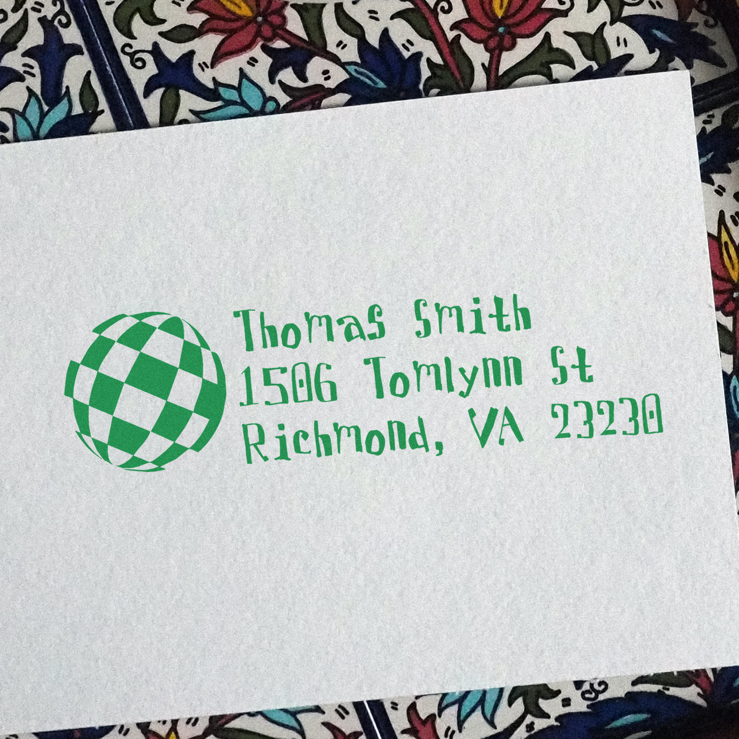 Green custom address rubber stamp for Thomas Smith, 1506 Tomlynn St, Richmond, VA 23230, with globe logo.