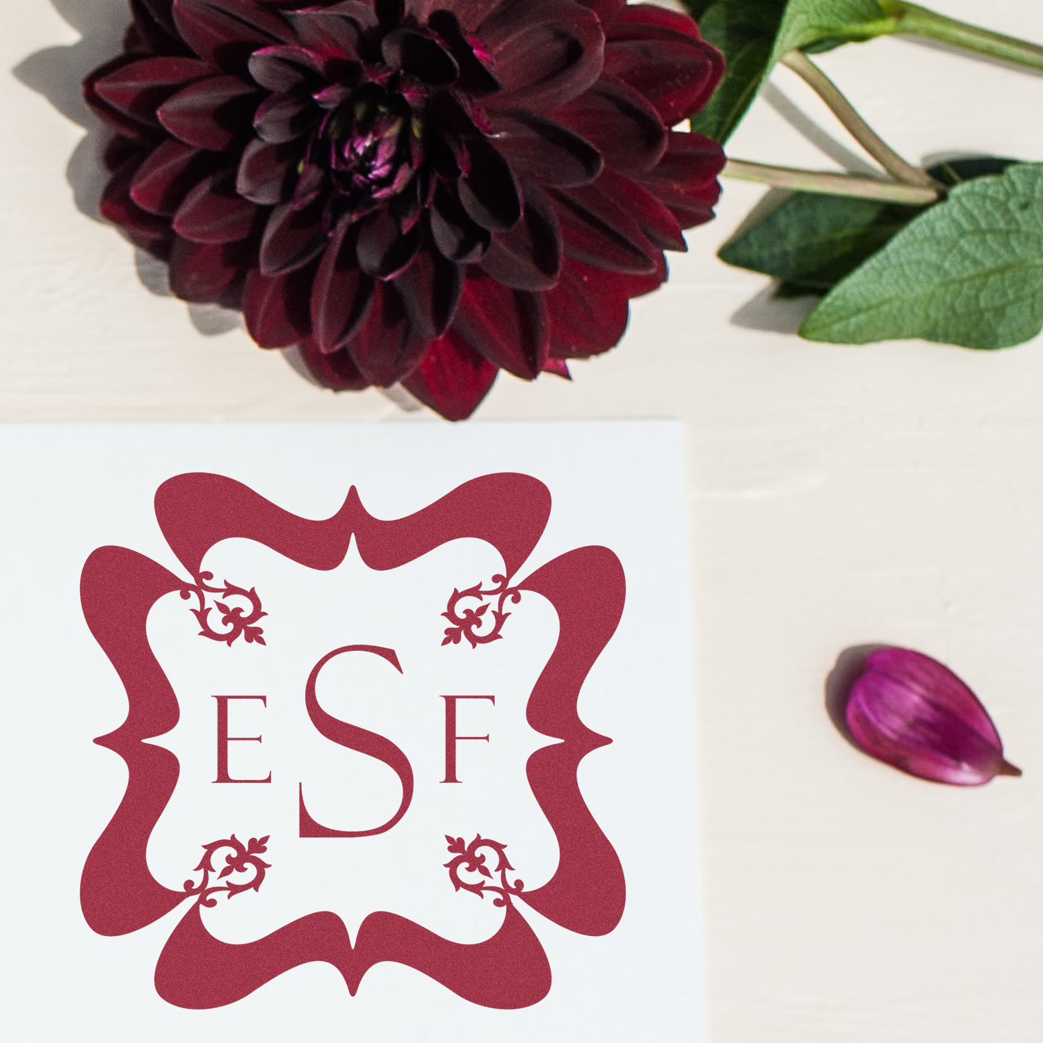Custom floral monogram rubber stamp with ESF initials and burgundy flower motif for personalized stationery.