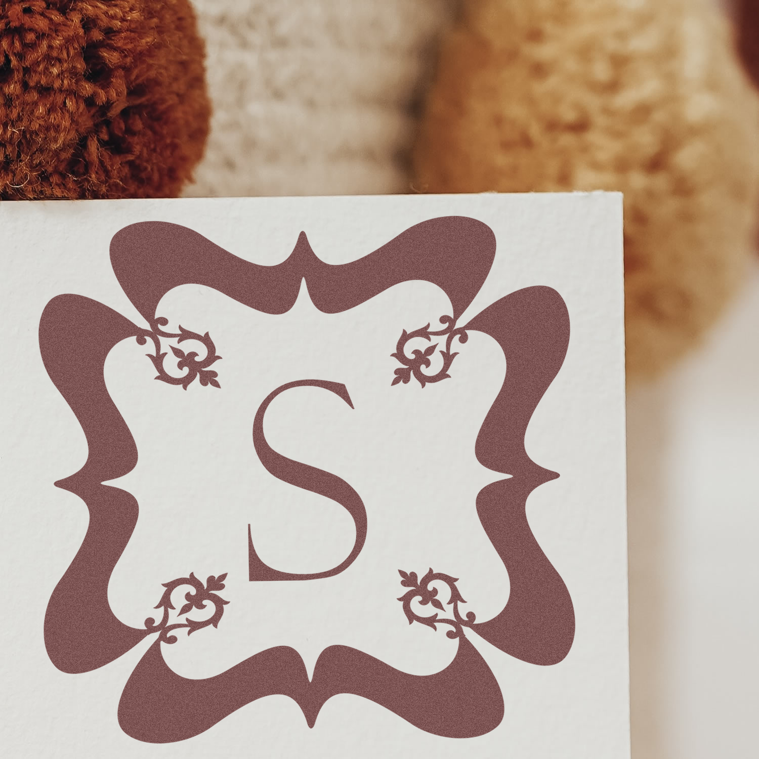 Ornate monogram S rubber stamp for personalized stationery, wedding invitations, and custom branding.