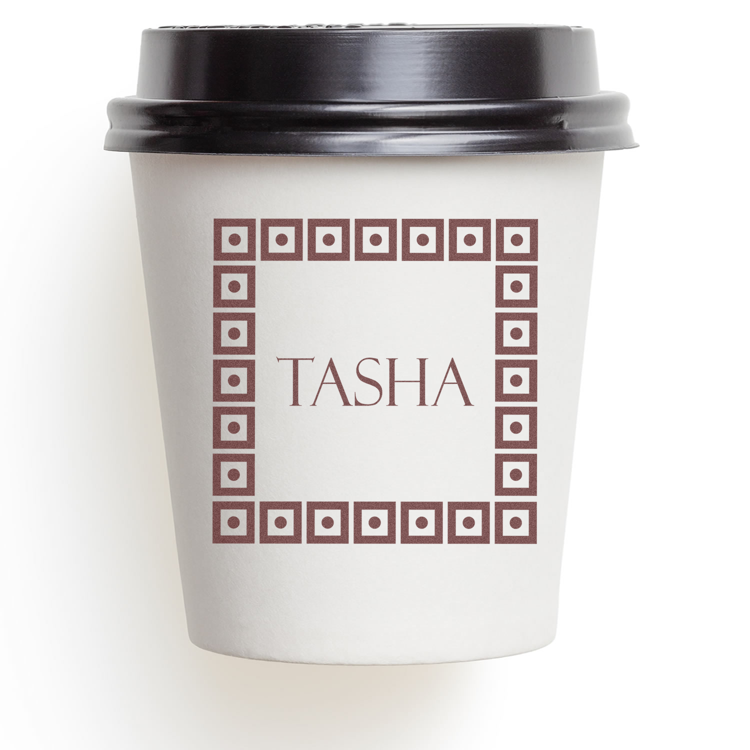Custom rubber stamp mockup featuring the name Tasha in a square decorative border on a coffee cup.