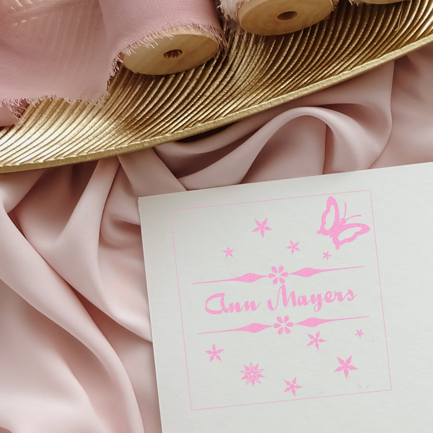 Personalized rubber stamp for Ann Mayers with butterfly and star design, perfect for branding stationery and packaging.