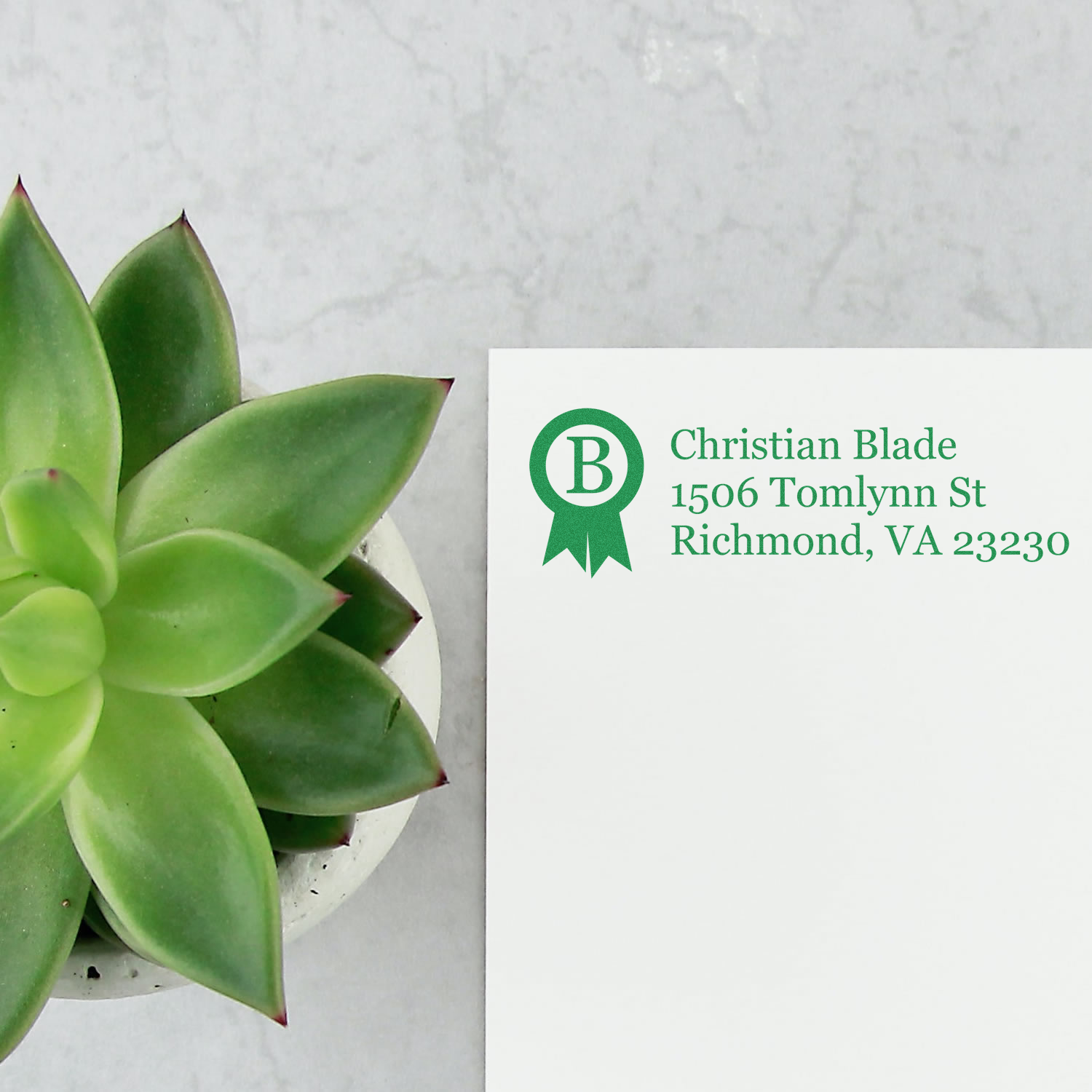 Custom return address rubber stamp with monogram logo and green ink for Christian Blade, Richmond, VA 23230.