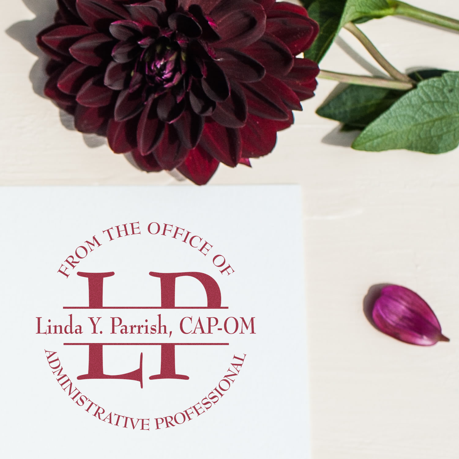 Custom rubber stamp for Linda Y. Parrish, CAP-OM, featuring From the Office of and Administrative Professional design.