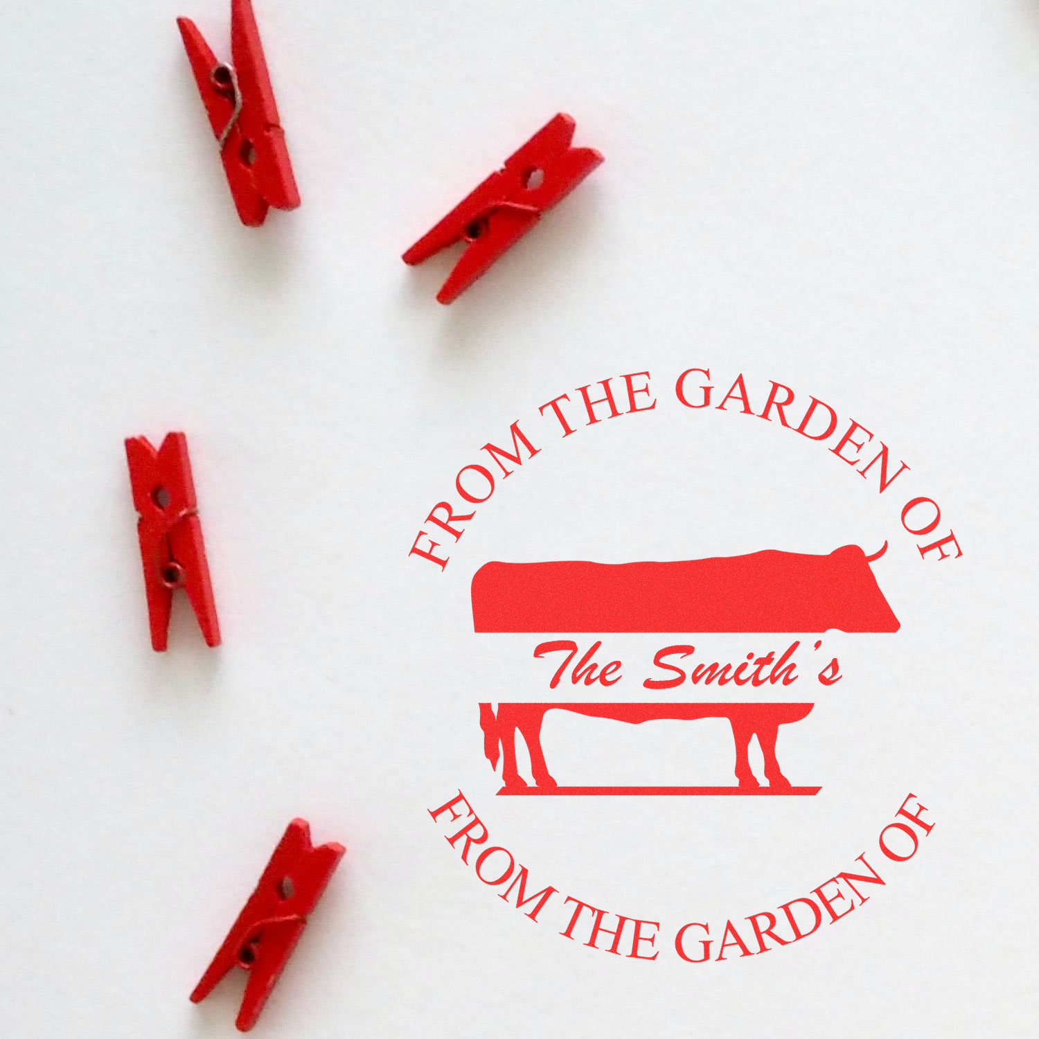 Custom rubber stamp design with From the Garden of The Smiths and red clothespins on a white background.