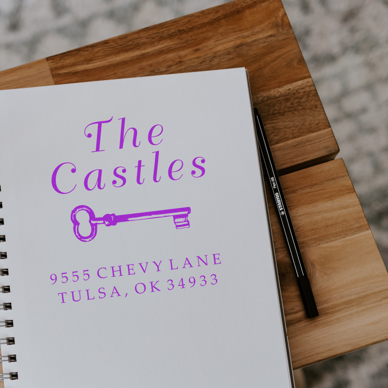 Personalized rubber address stamp with key design for The Castles family stationery and mailing.