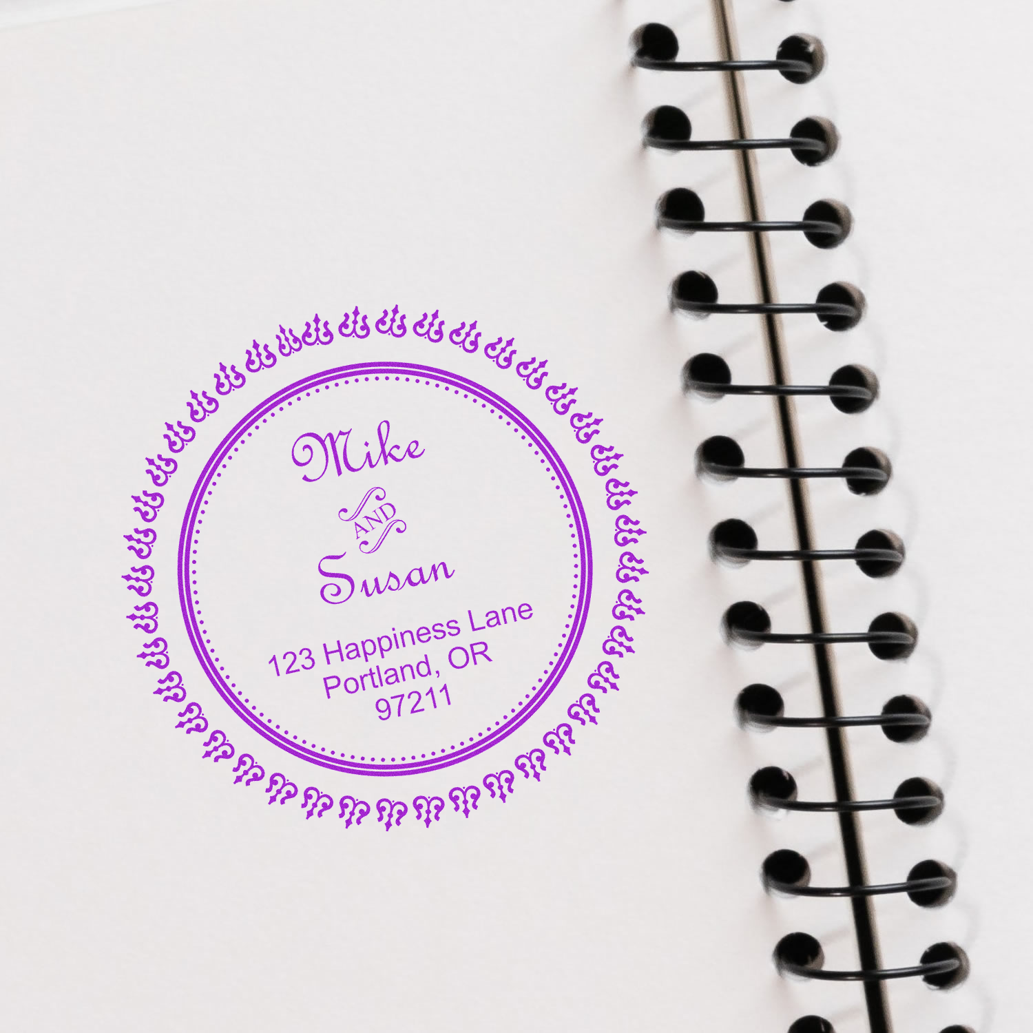 Personalized address label on planner notebook for Mike and Susan, 123 Happiness Lane, Portland OR 97211.