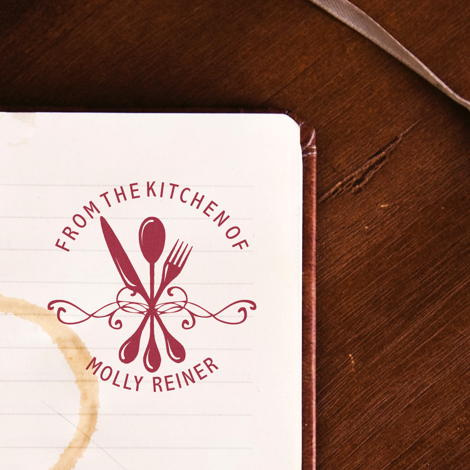Custom rubber stamp reading From the Kitchen of Molly Reiner with spoon, fork and knife for recipe books and kitchen gifts.